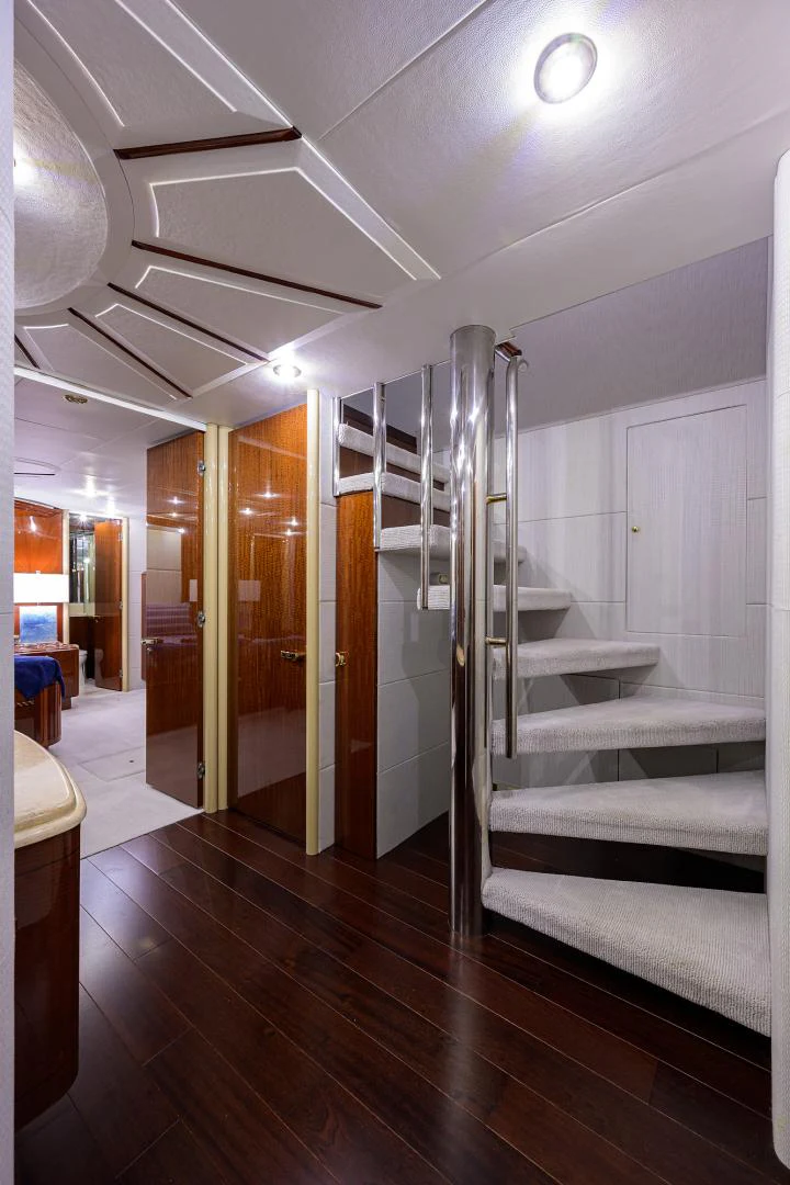 a room with a staircase and a glass door aboard TRYST Yacht for Sale