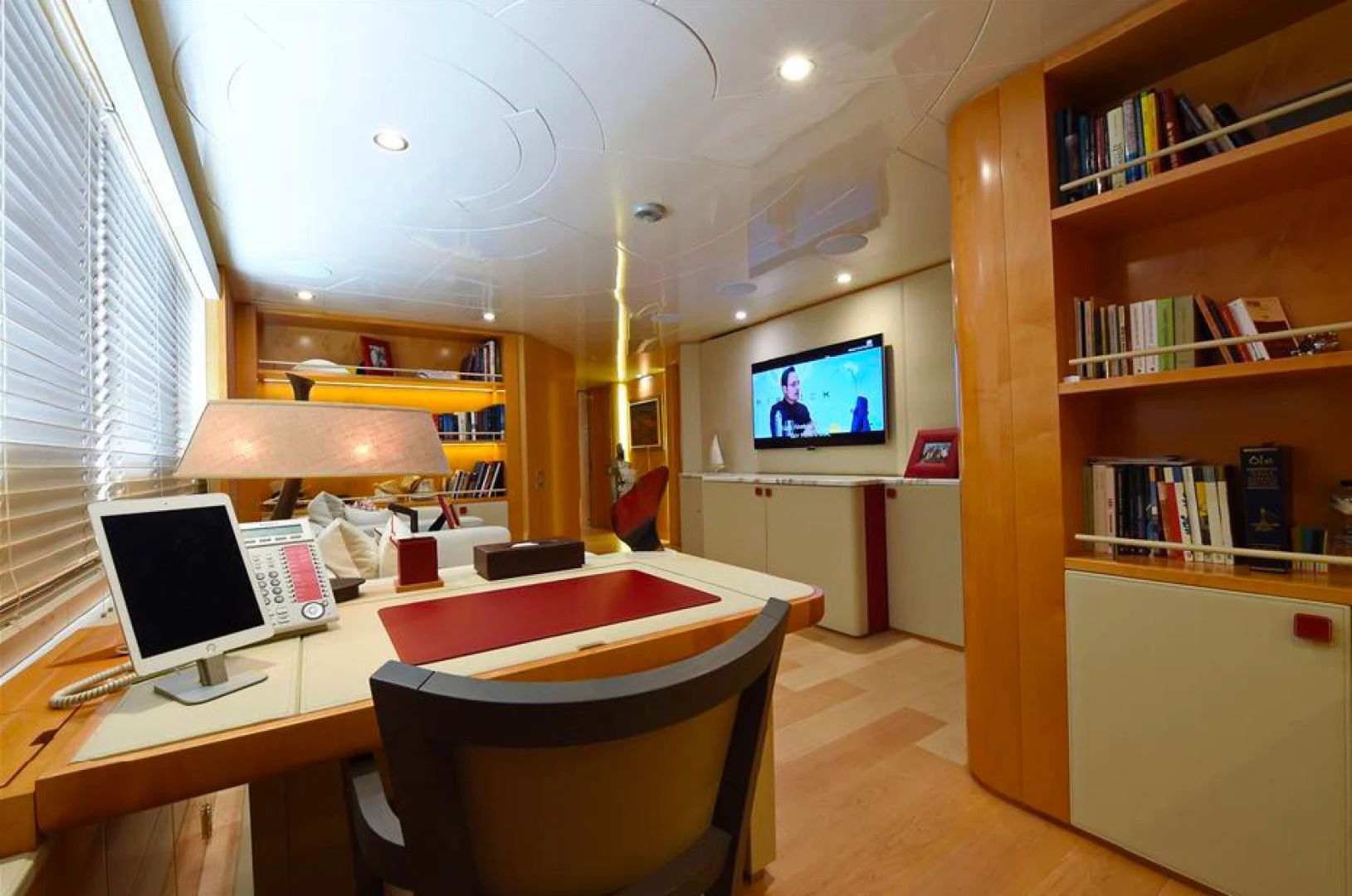 a room with a desk and a tv aboard AMORE MIO 2 Yacht for Sale