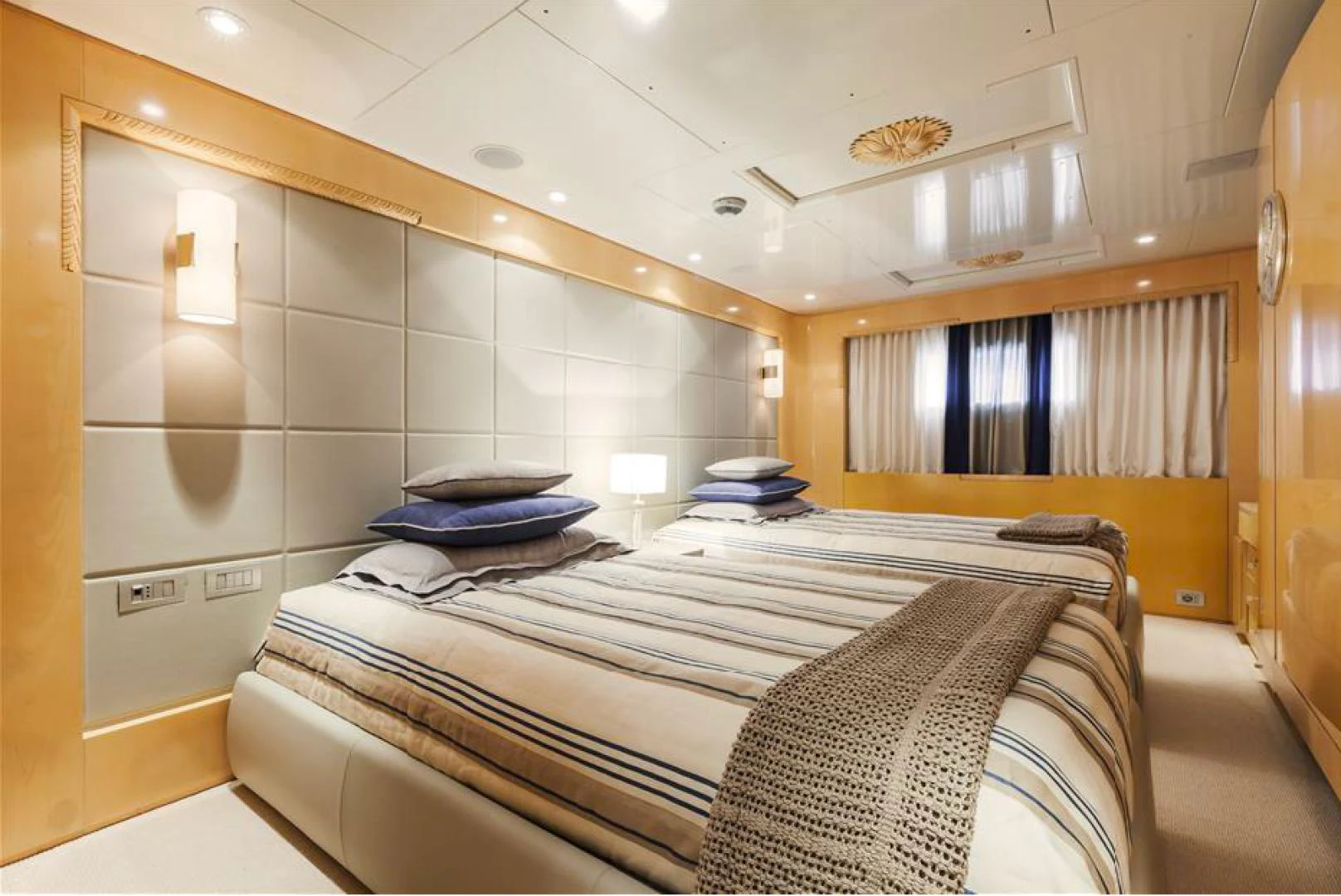 a room with a bed and a window aboard AMORE MIO 2 Yacht for Sale