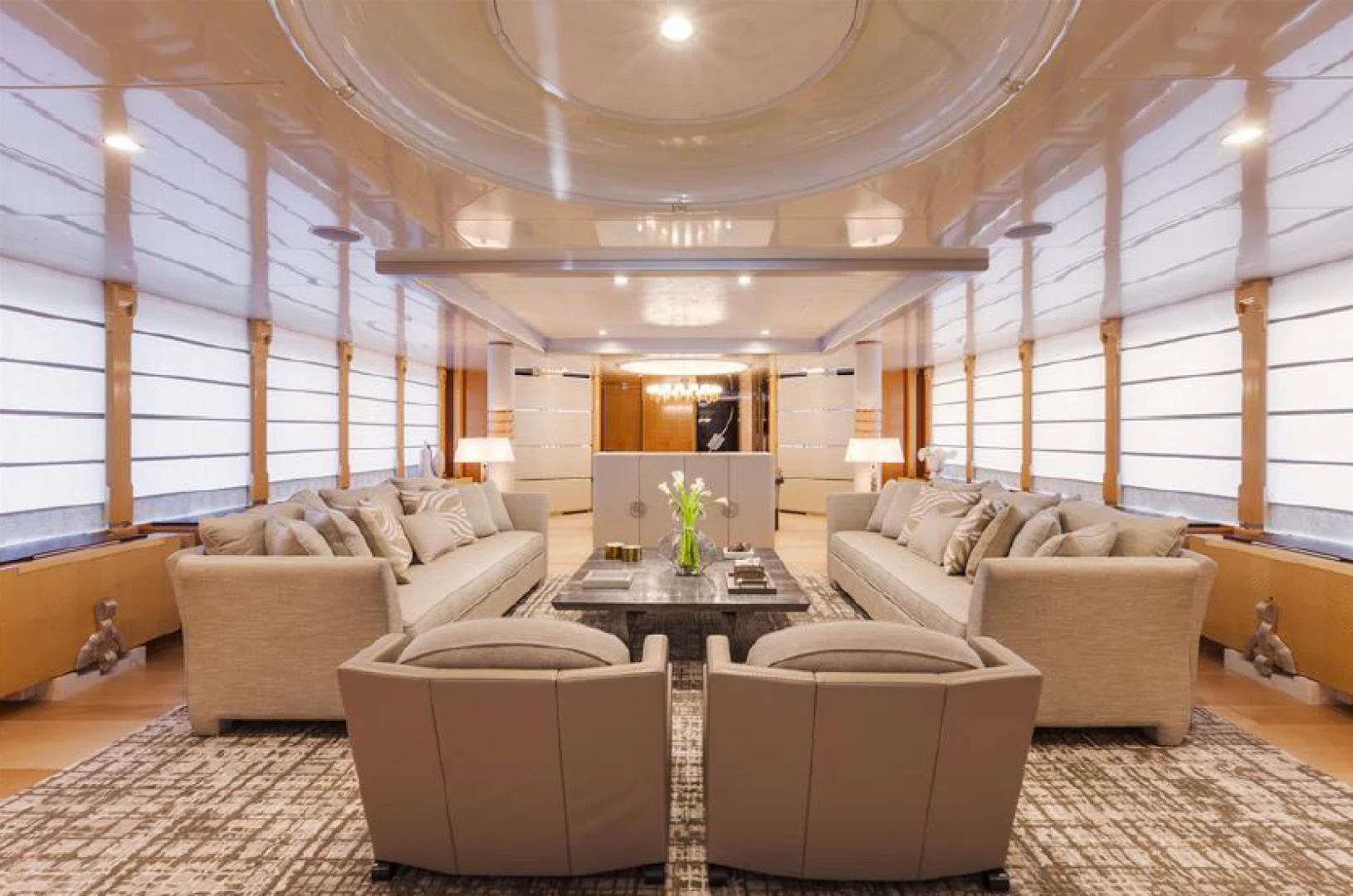 a room with couches and a table aboard AMORE MIO 2 Yacht for Sale