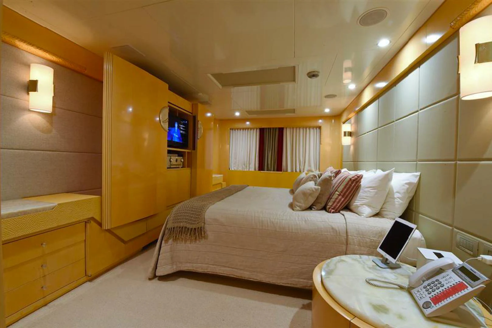 a bed in a room aboard AMORE MIO 2 Yacht for Sale