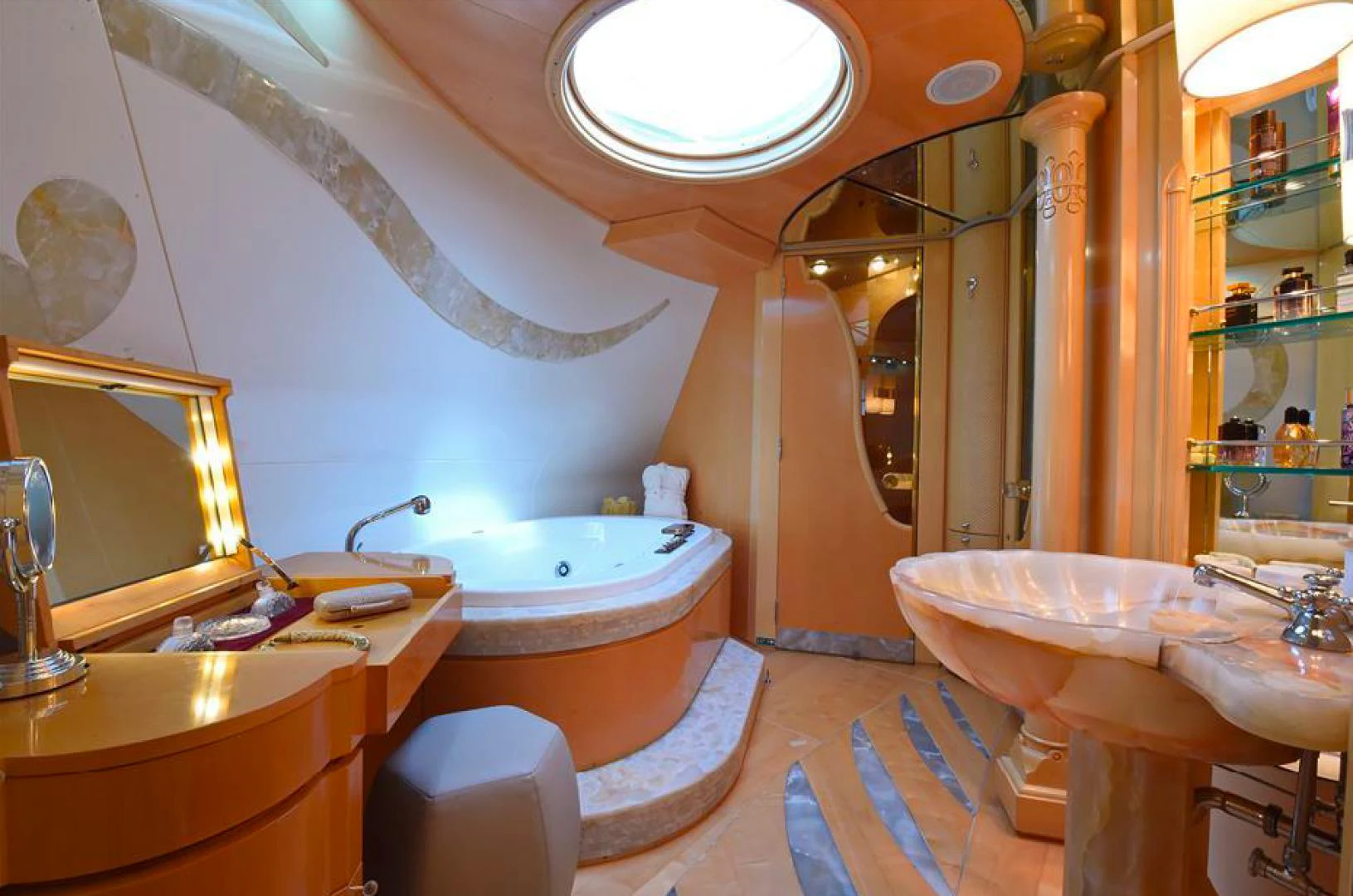 a bathroom with a tub sink and sinks aboard AMORE MIO 2 Yacht for Sale