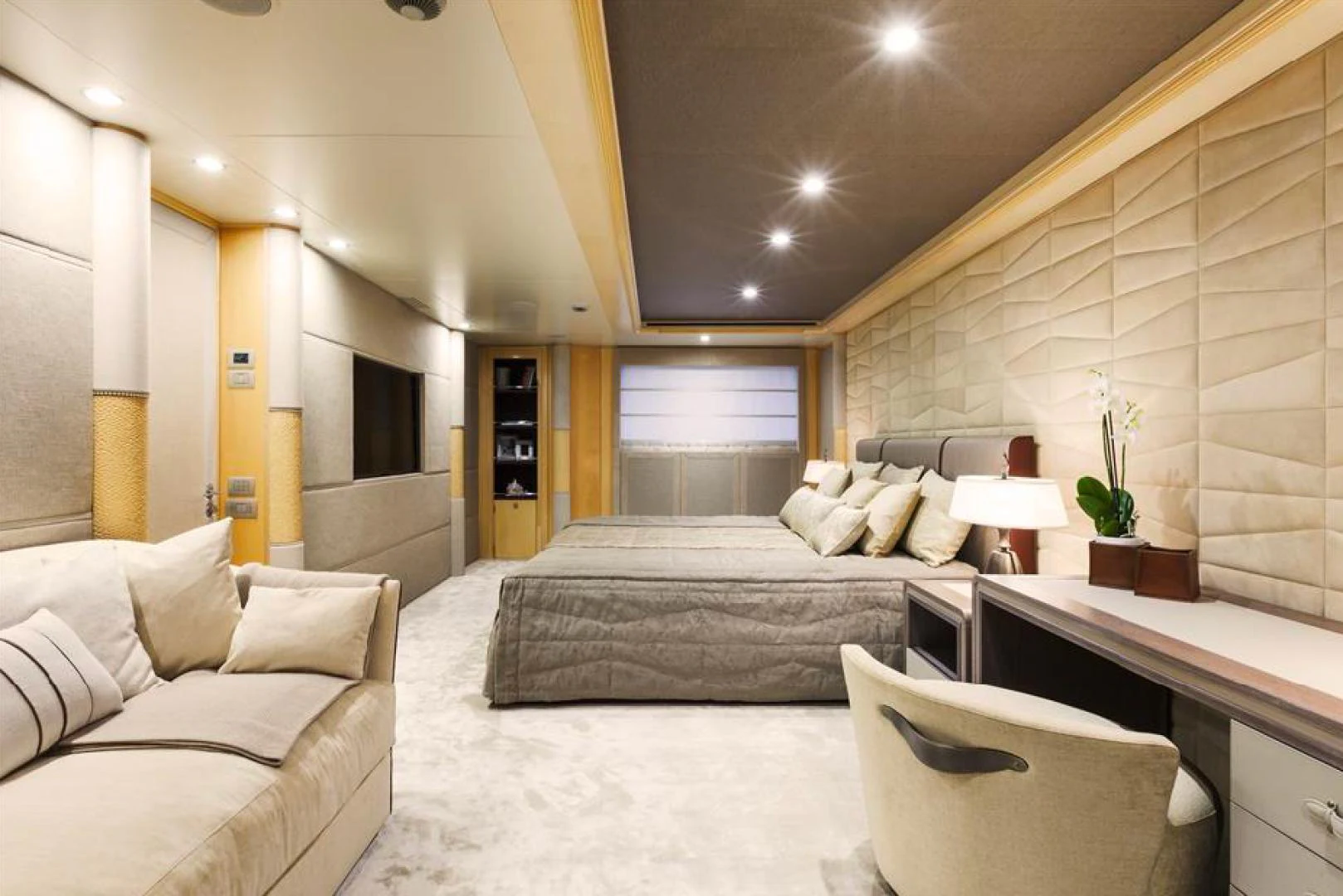 a room with a bed and a chair aboard AMORE MIO 2 Yacht for Sale