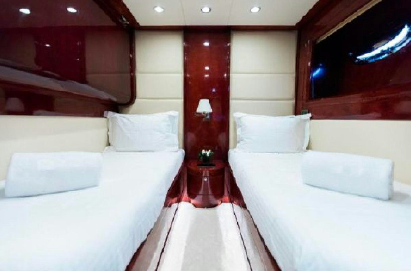 a room with beds and a table aboard ALBATOR 2 Yacht for Sale