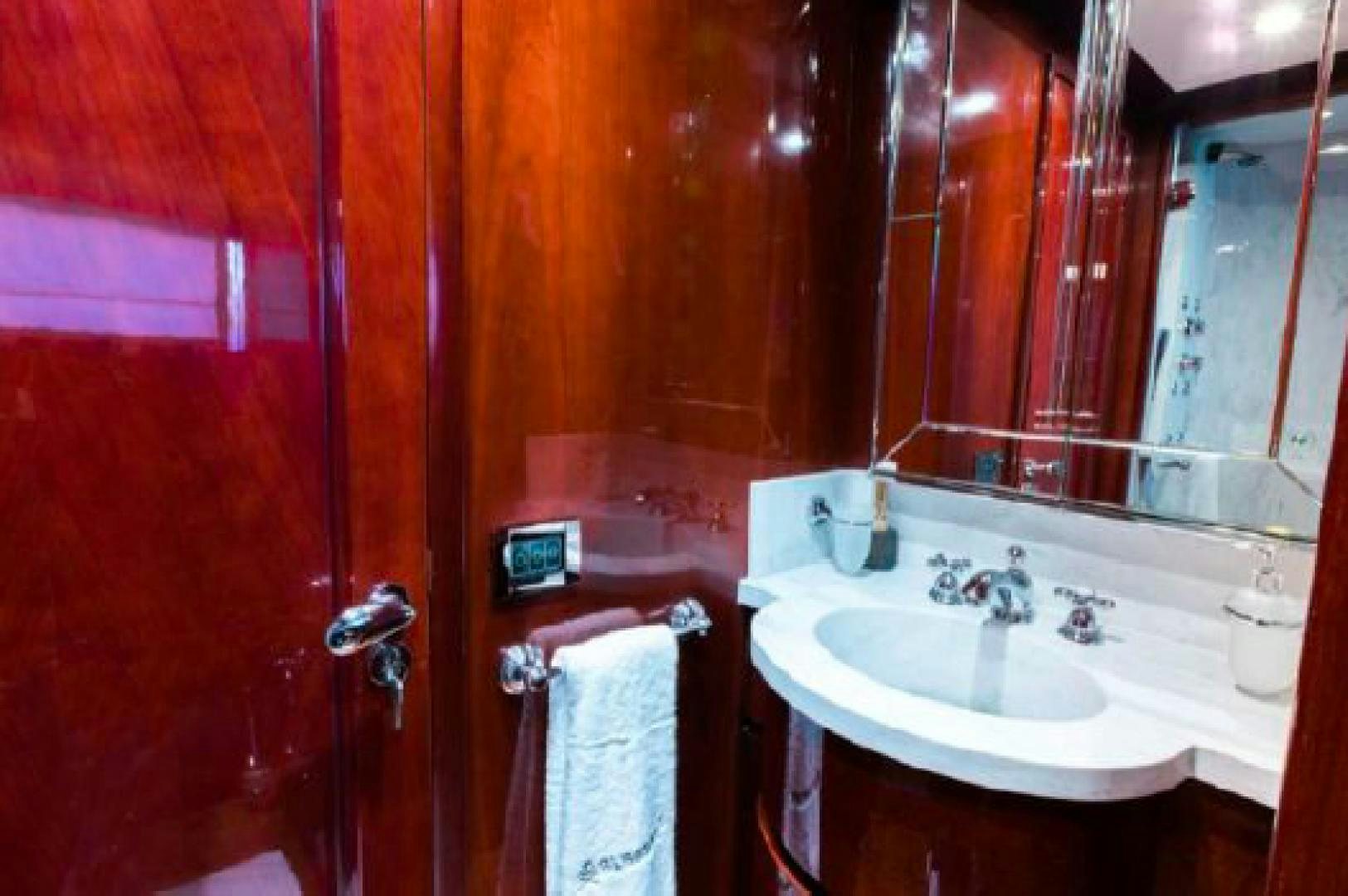 a bathroom with red walls aboard ALBATOR 2 Yacht for Sale