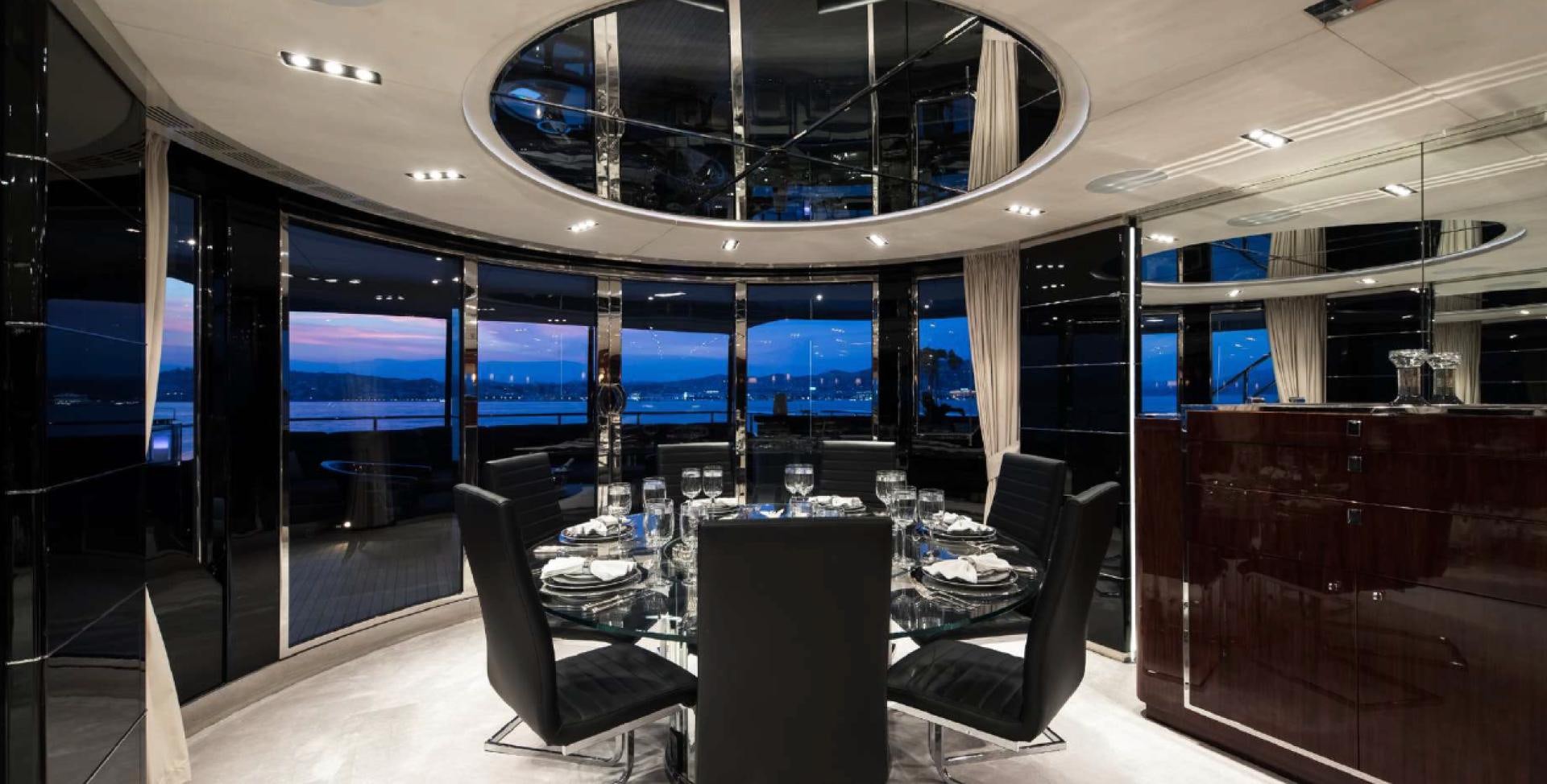 a room with a table and chairs aboard BLISS Yacht for Charter