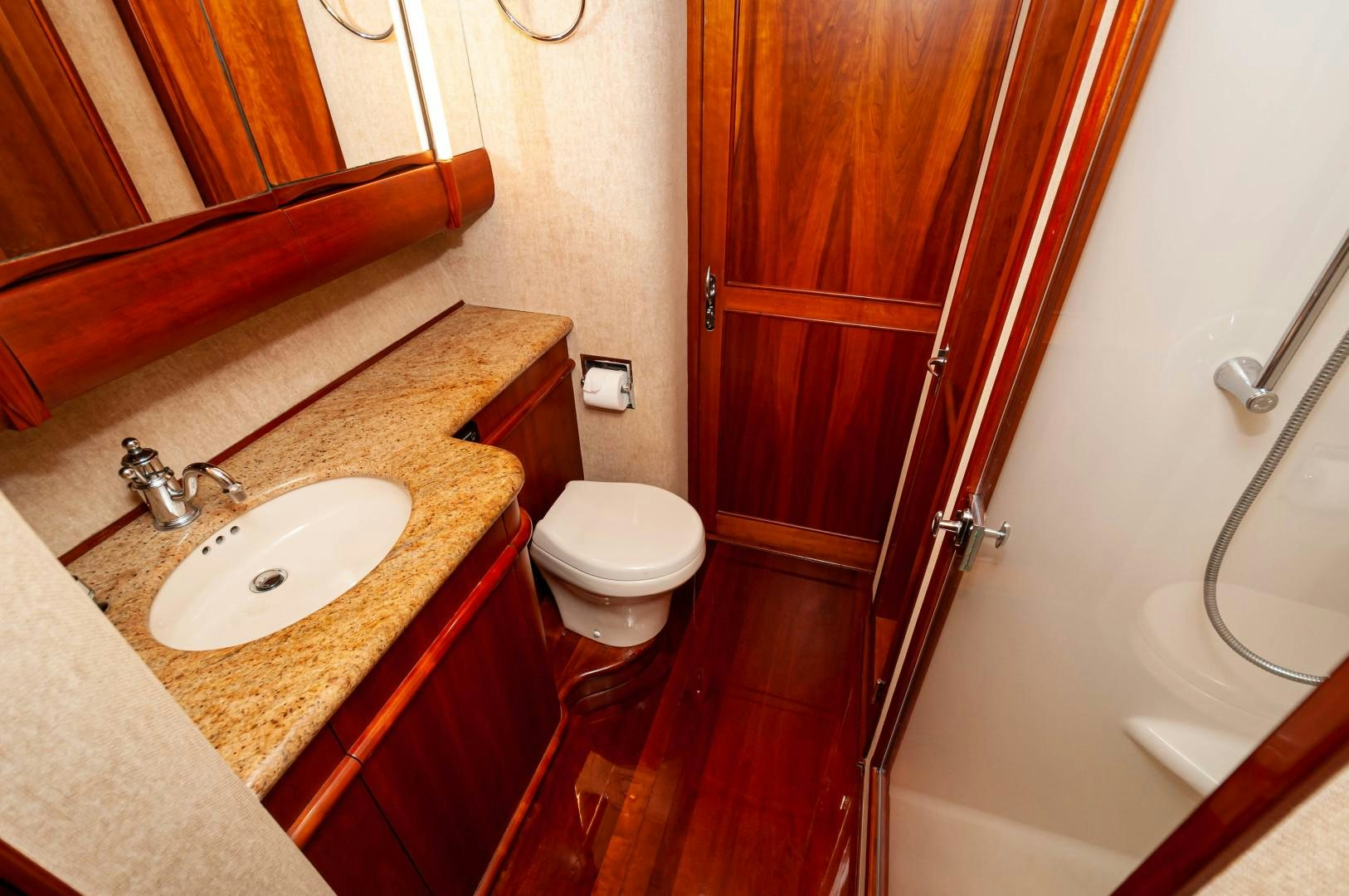a bathroom with a toilet and sink aboard BANK ON Yacht for Sale