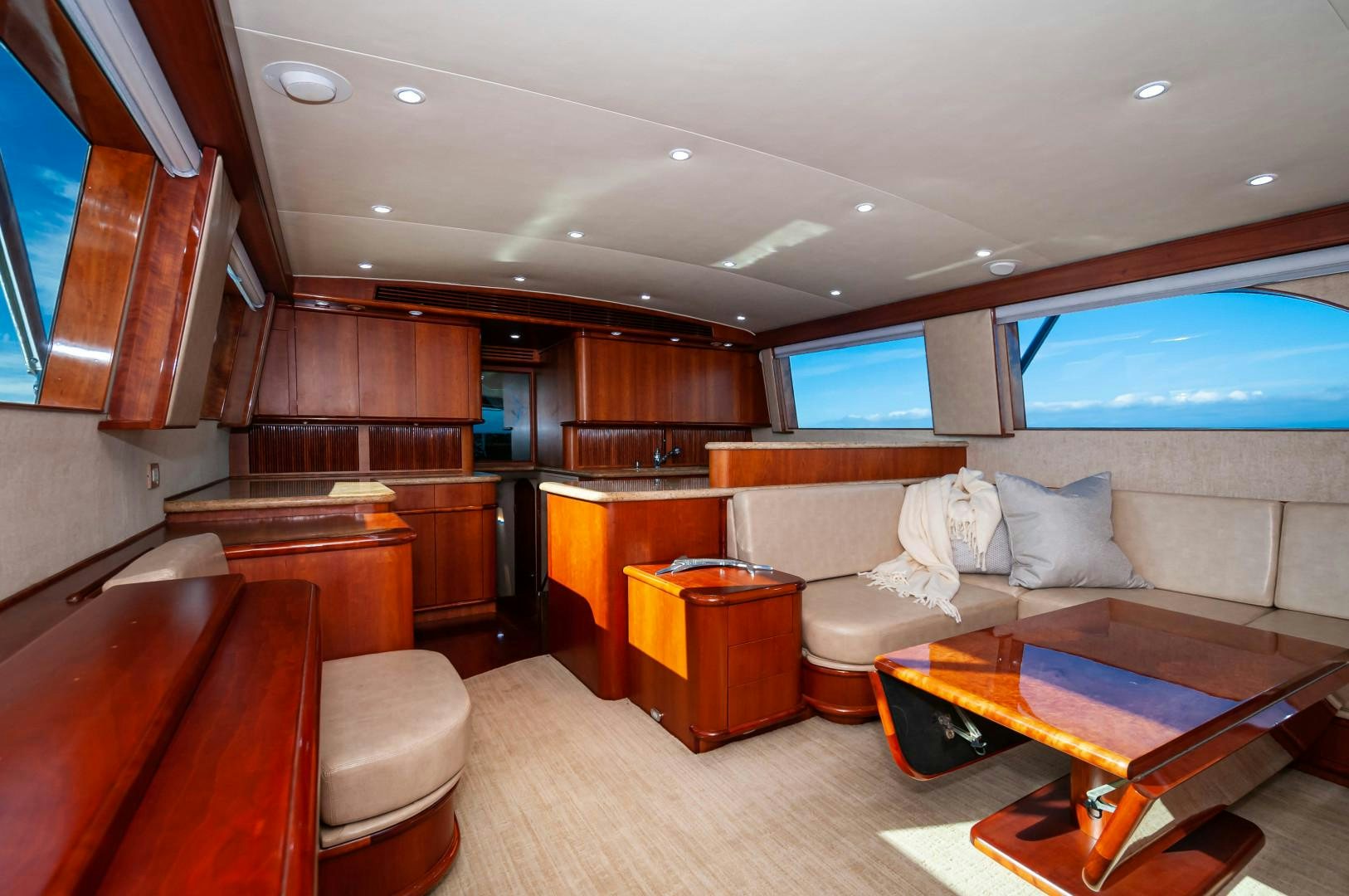 a living room with a couch and a table aboard BANK ON Yacht for Sale