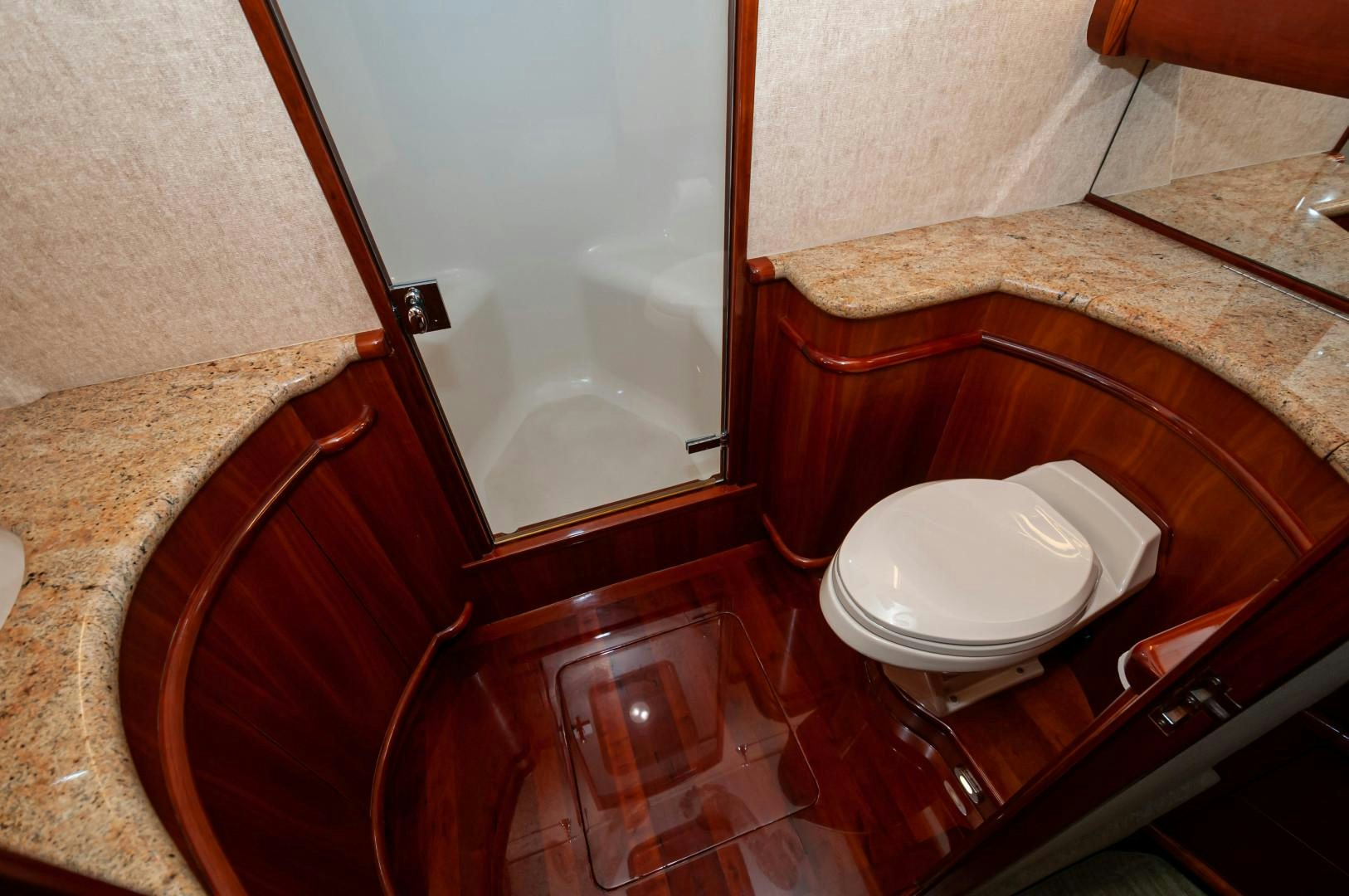 a toilet sits in a bathroom aboard BANK ON Yacht for Sale