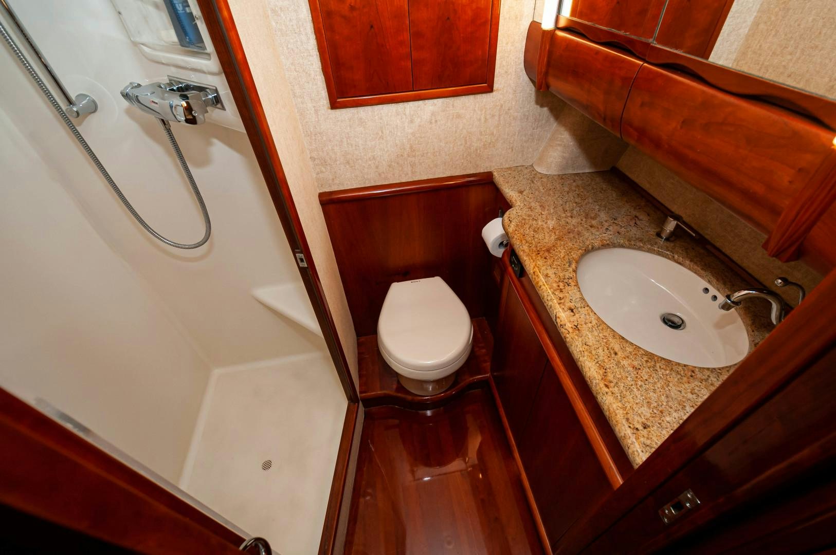a bathroom with a sink and toilet aboard BANK ON Yacht for Sale