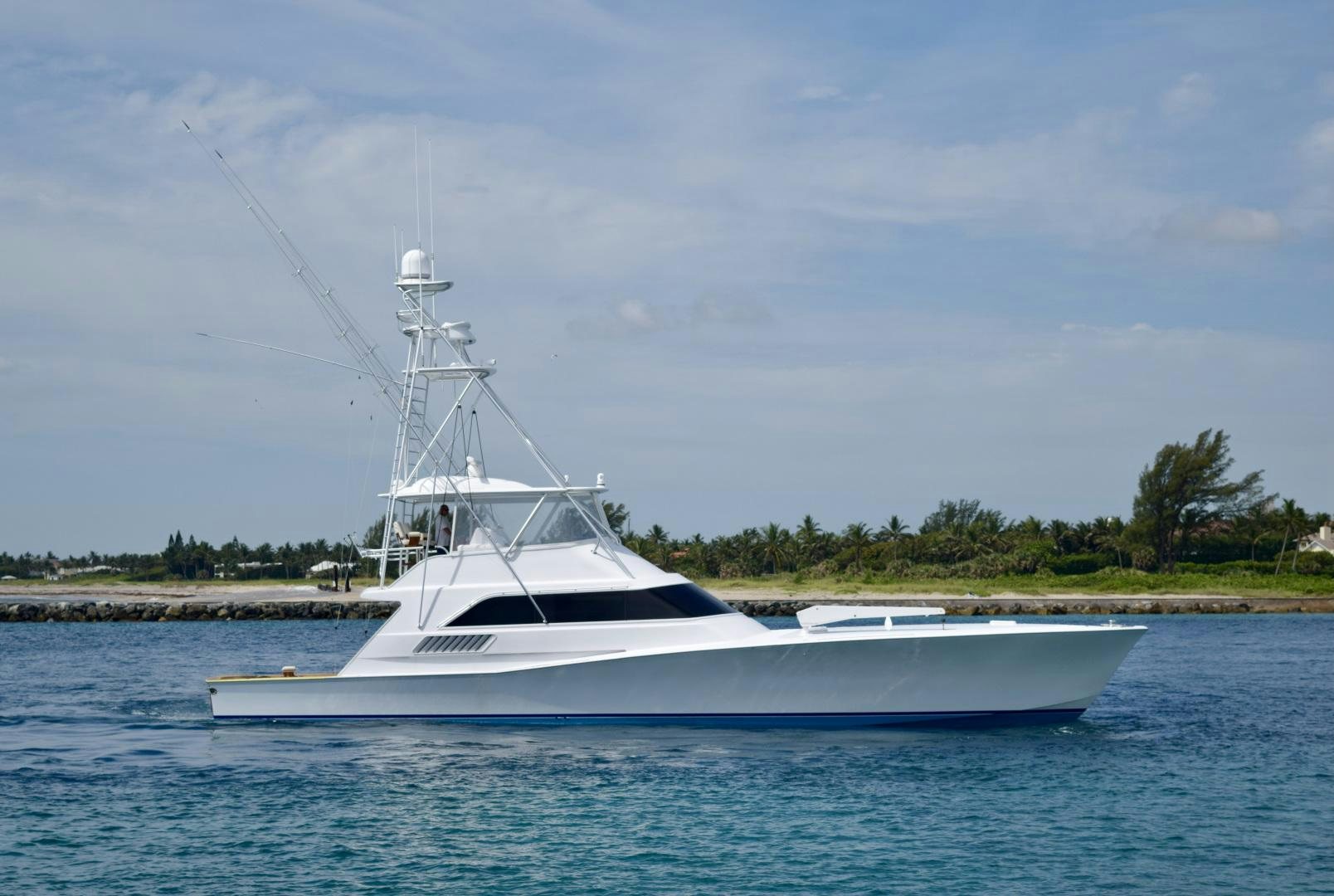 a white boat on the water aboard BANK ON Yacht for Sale