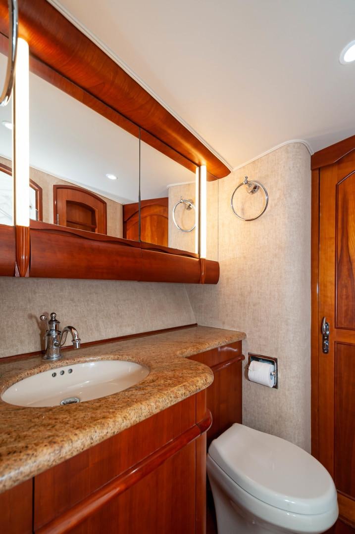 a bathroom with a sink and a toilet aboard BANK ON Yacht for Sale
