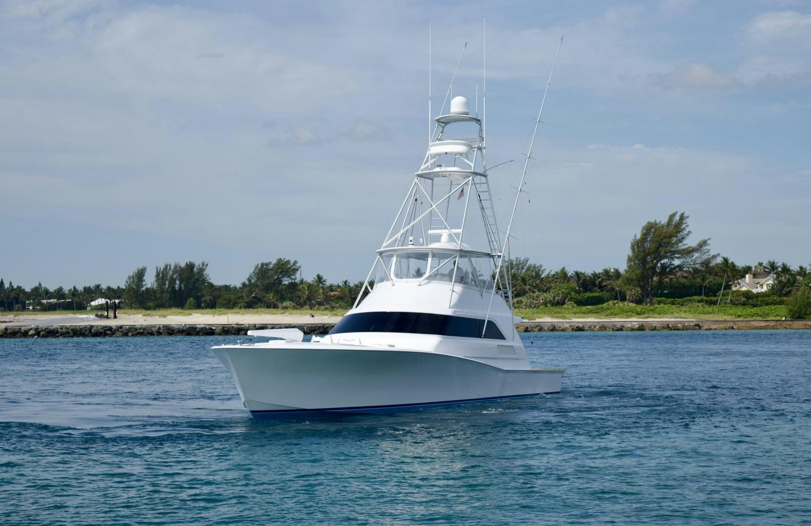 a white boat on the water aboard BANK ON Yacht for Sale