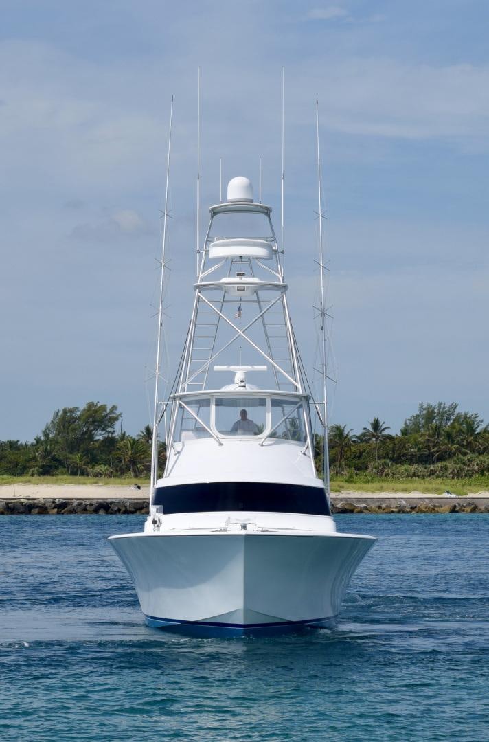 a white boat on the water aboard BANK ON Yacht for Sale