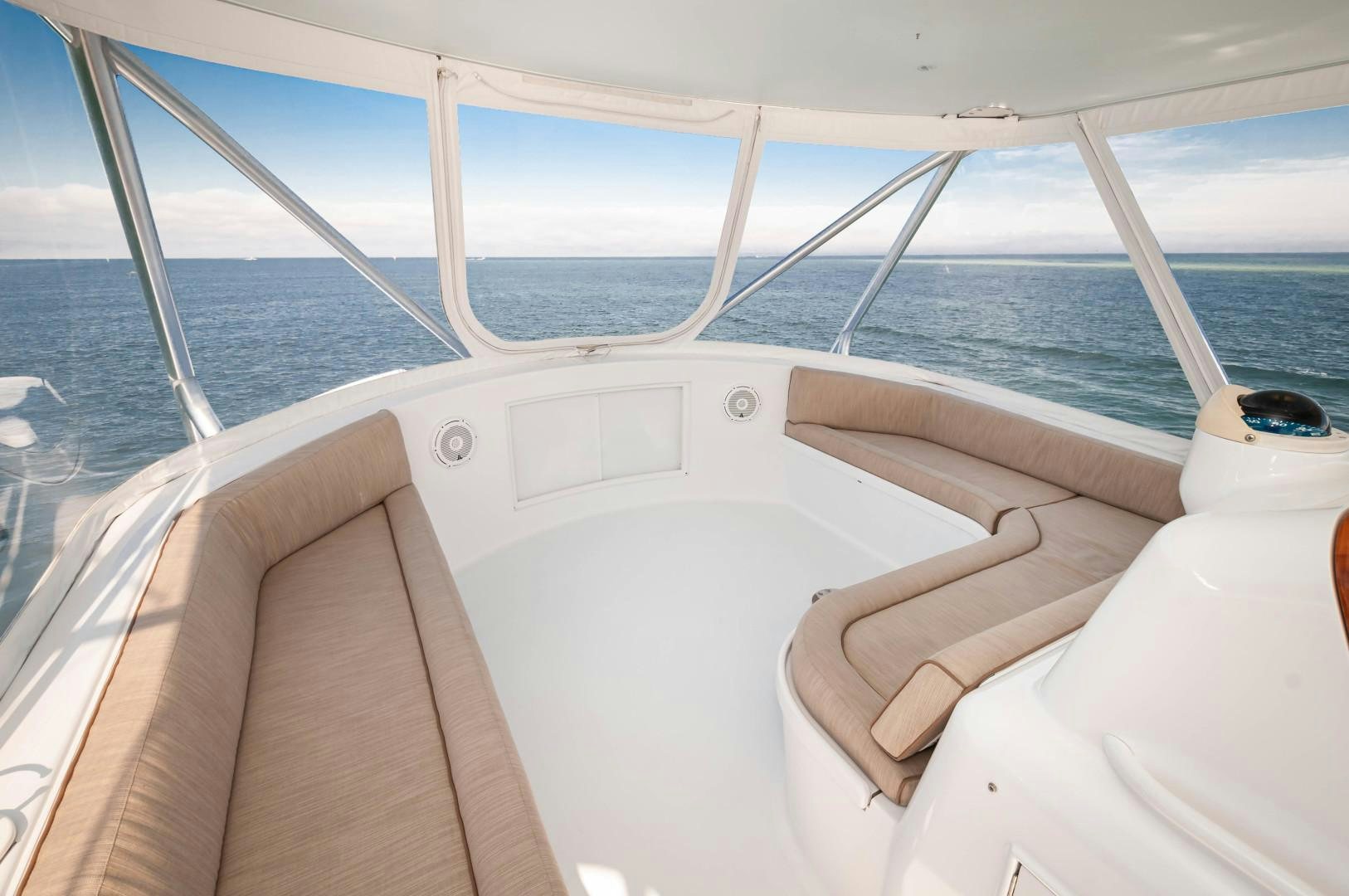 a white boat with a white bed aboard BANK ON Yacht for Sale