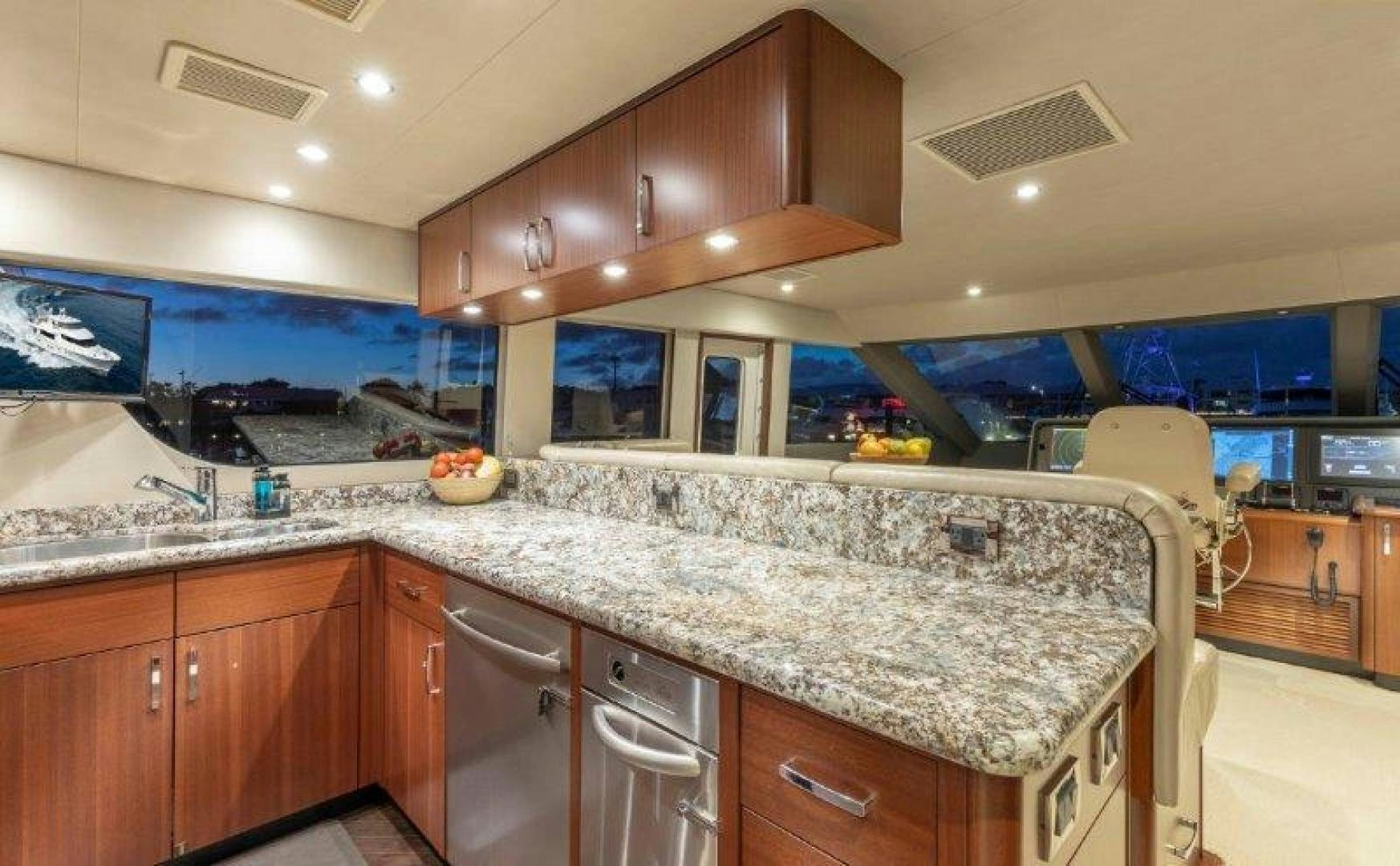 a kitchen with a large island aboard CHERRY BOMB Yacht for Sale