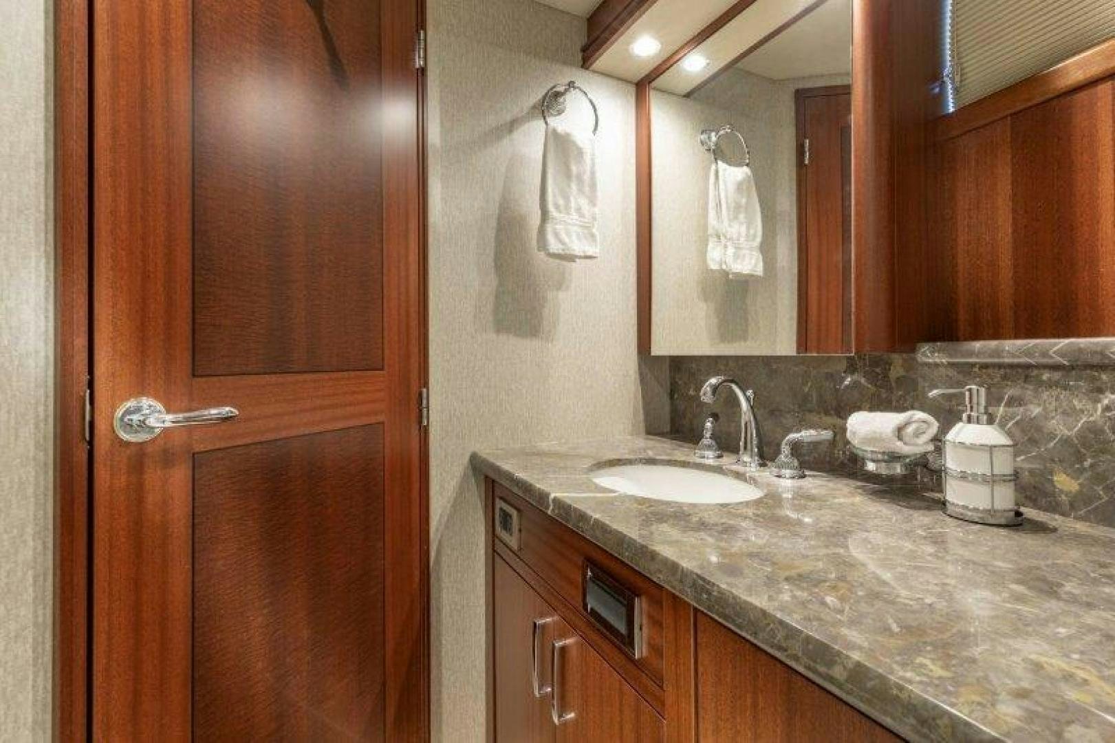 a bathroom with a countertop sink and cabinets aboard CHERRY BOMB Yacht for Sale