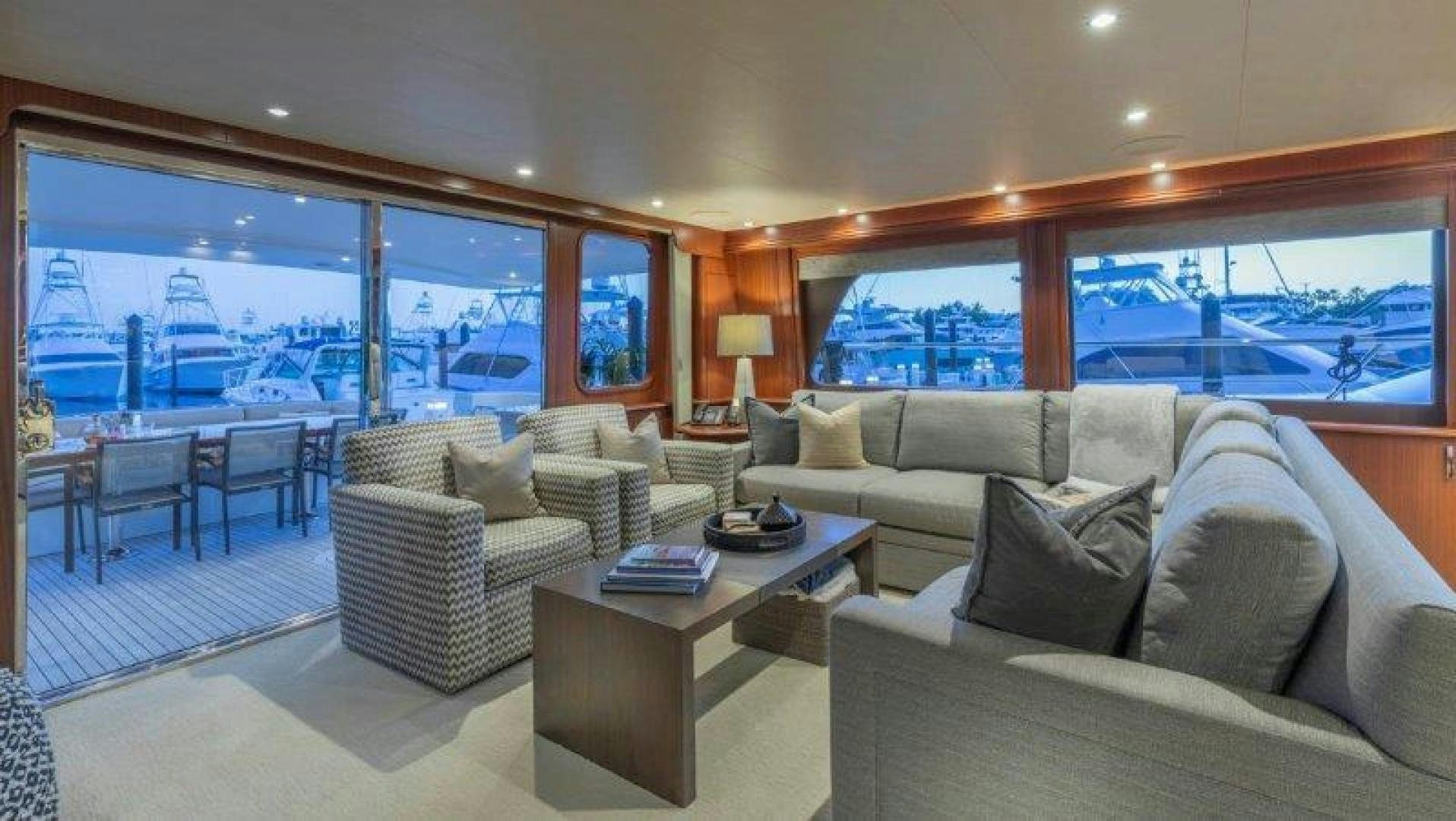 a living room with a large window aboard CHERRY BOMB Yacht for Sale