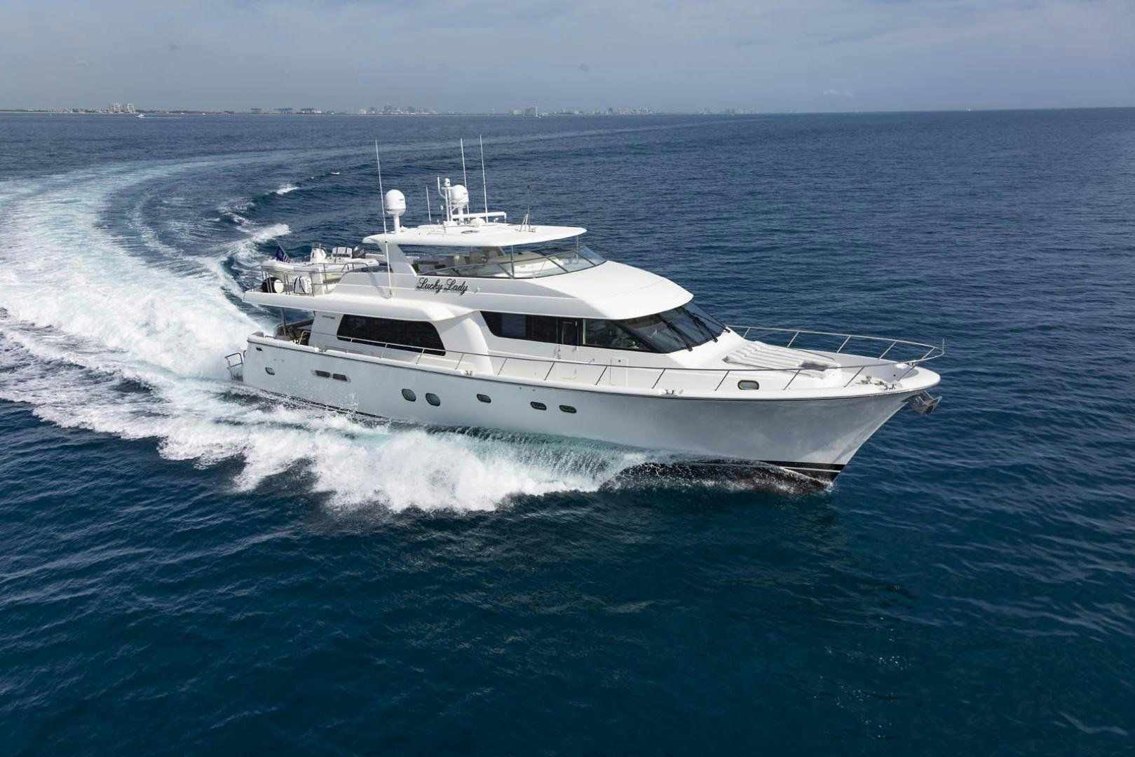 a white yacht on the water aboard CHERRY BOMB Yacht for Sale