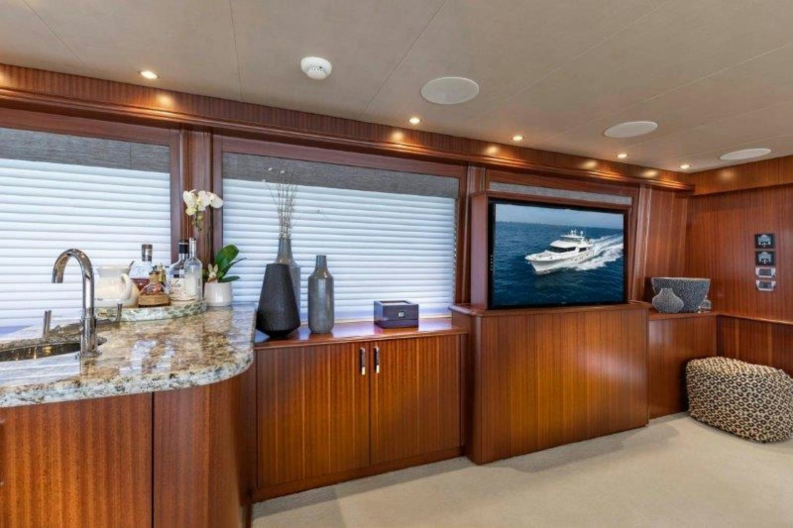 a kitchen with wooden cabinets aboard CHERRY BOMB Yacht for Sale