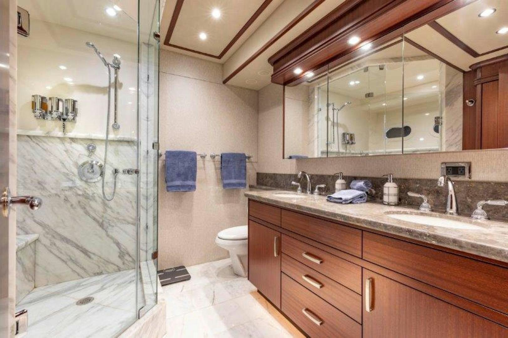 a bathroom with a glass shower aboard CHERRY BOMB Yacht for Sale