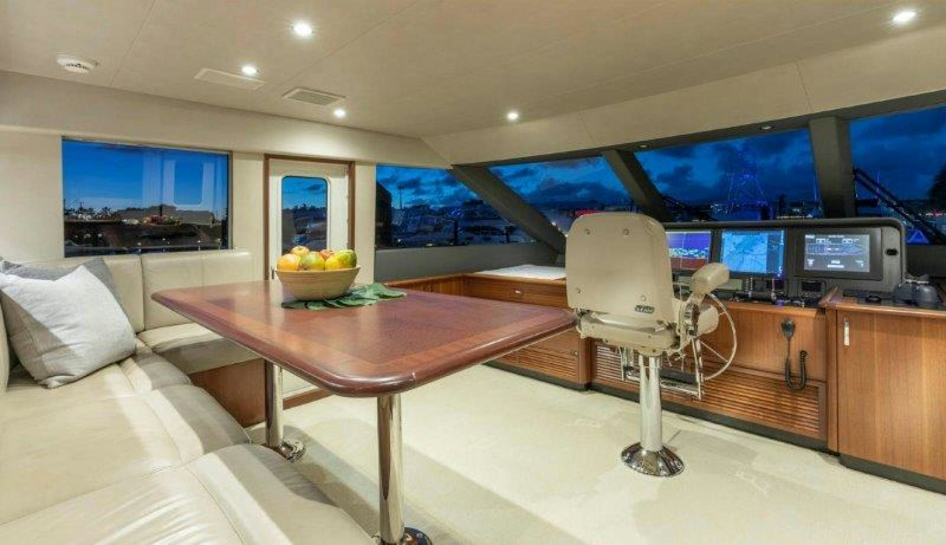 a room with a table and a fan aboard CHERRY BOMB Yacht for Sale
