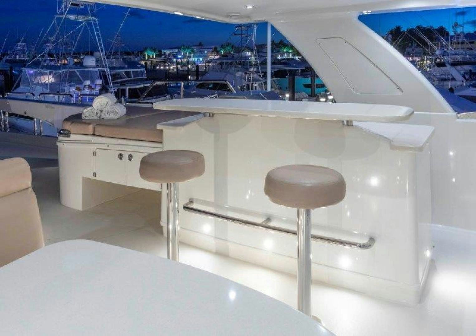 a white table with stools aboard CHERRY BOMB Yacht for Sale