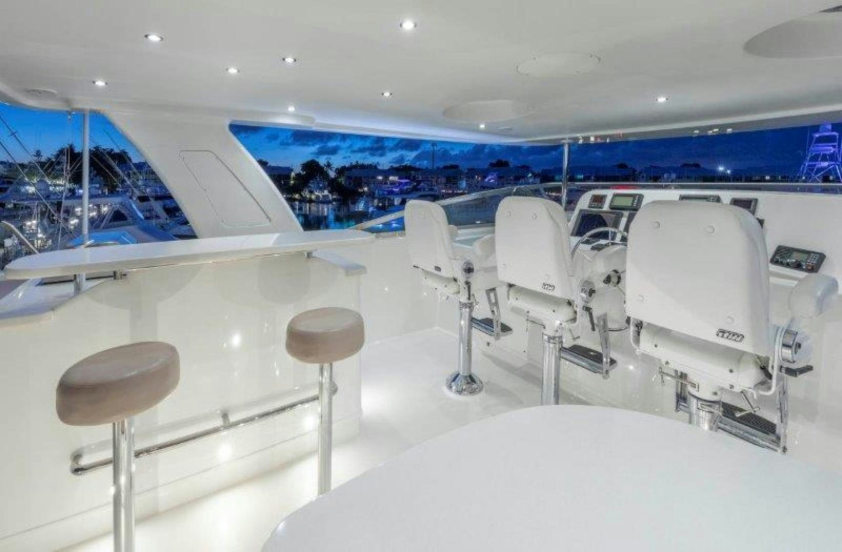 a room with chairs and tables aboard CHERRY BOMB Yacht for Sale
