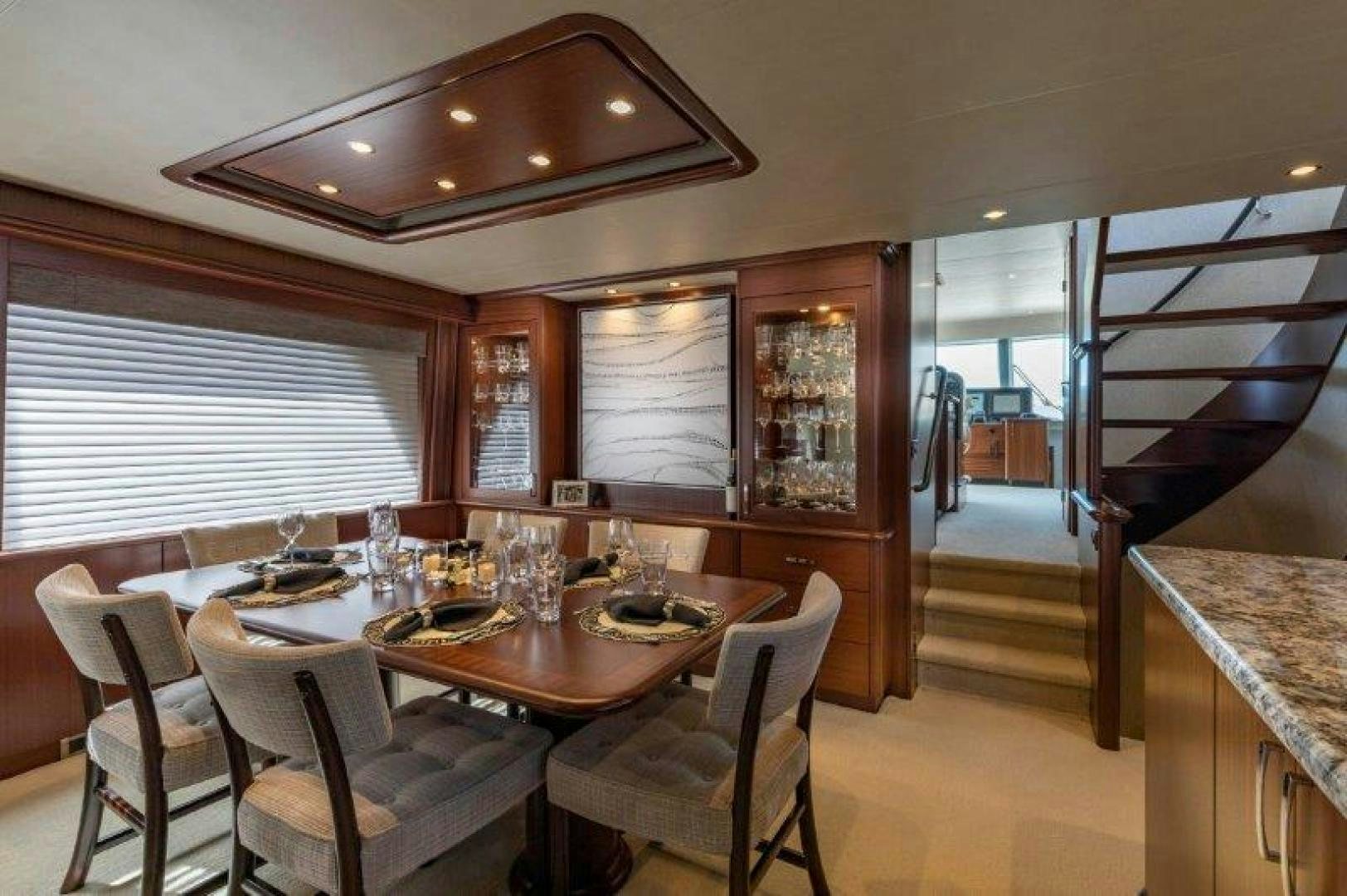 a dining room with a large open door aboard CHERRY BOMB Yacht for Sale