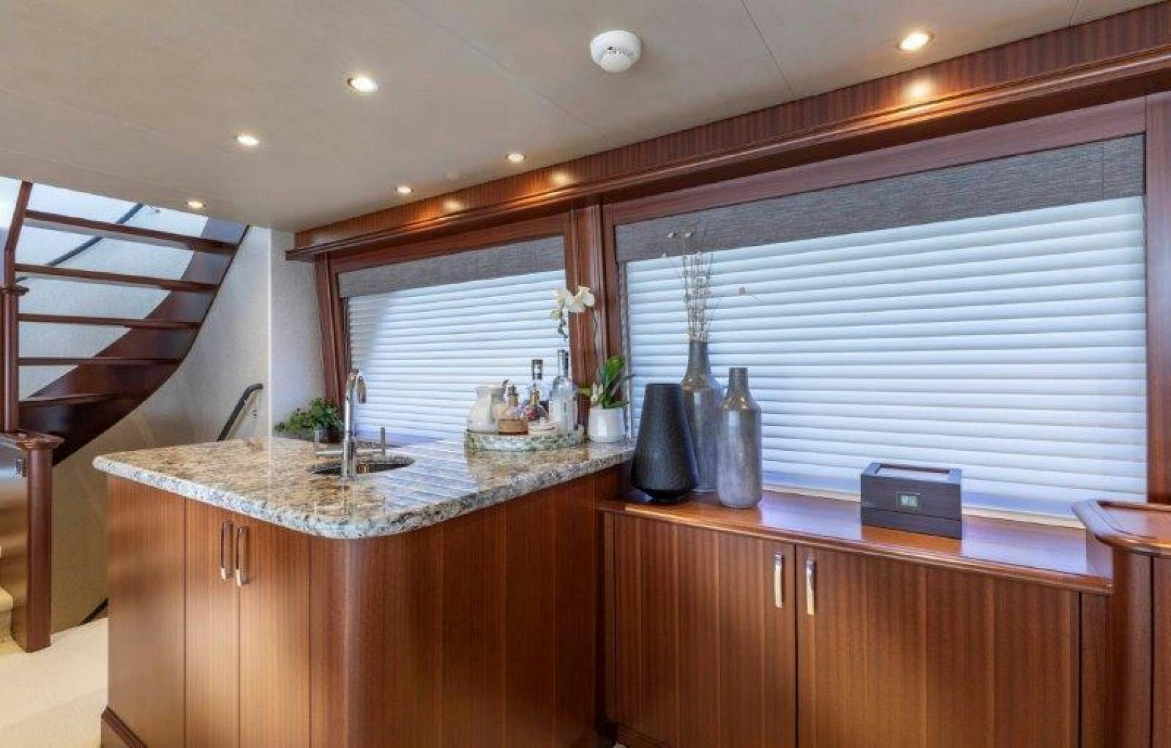 a kitchen with a large island aboard CHERRY BOMB Yacht for Sale