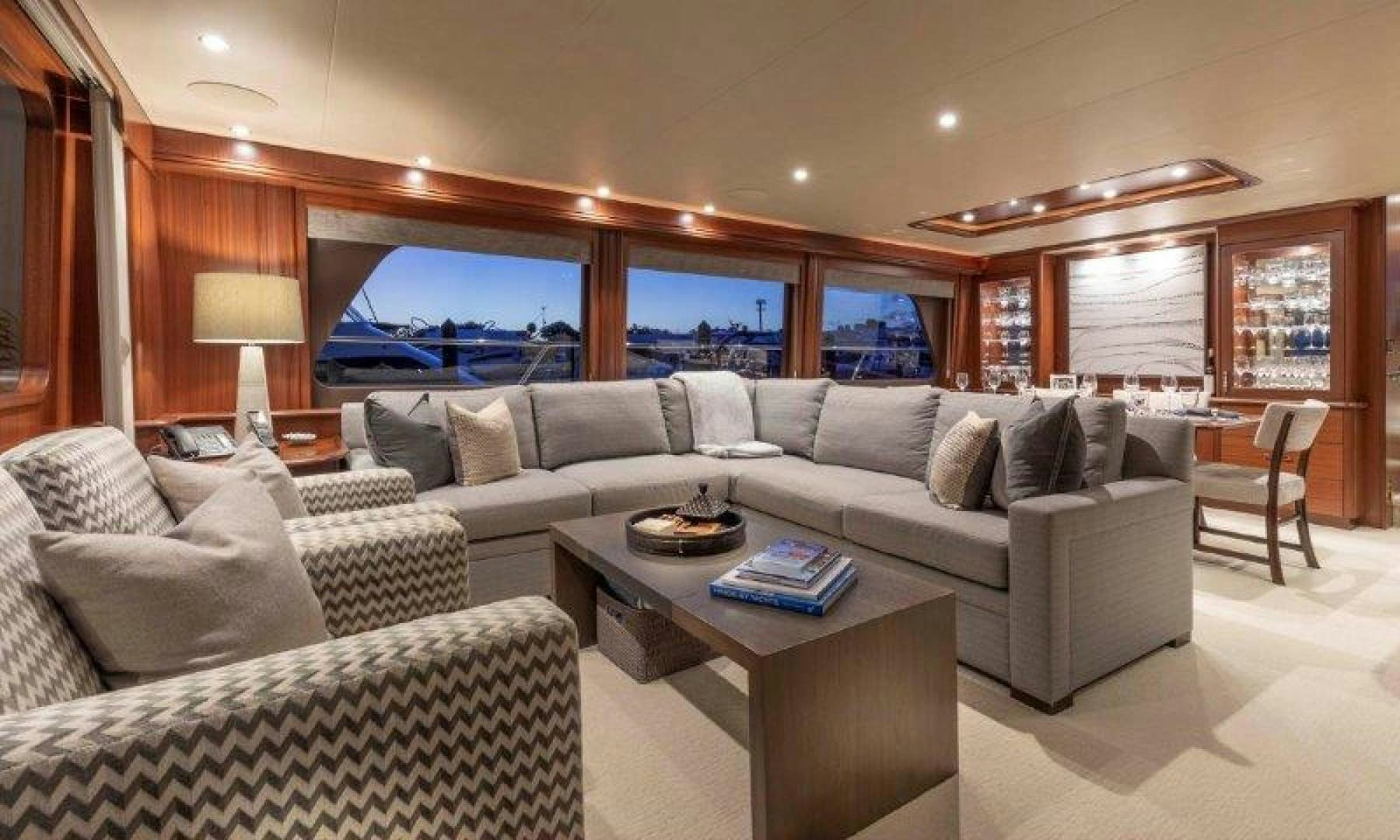 a living room with a large sofa and a large television aboard CHERRY BOMB Yacht for Sale