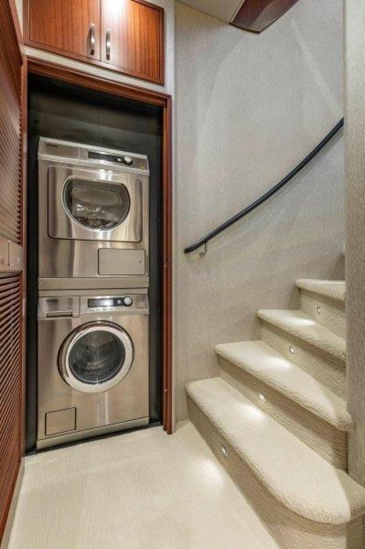 a washer and dryer in a kitchen aboard CHERRY BOMB Yacht for Sale