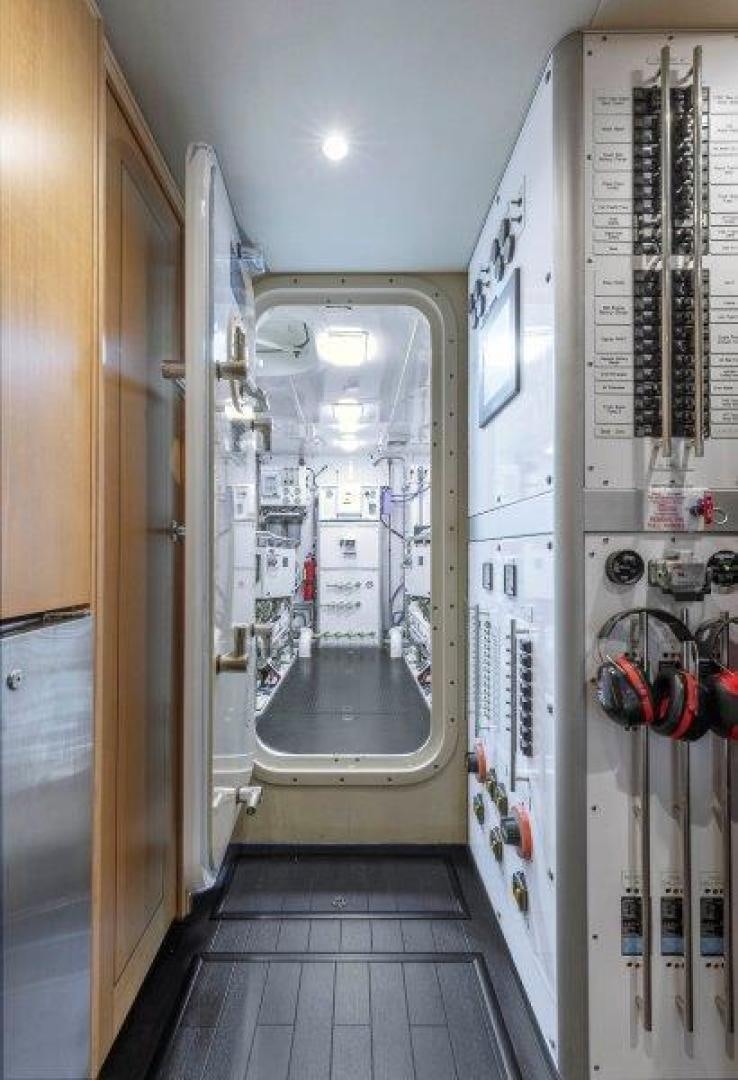 a hallway with a door and a wall with a door open aboard CHERRY BOMB Yacht for Sale