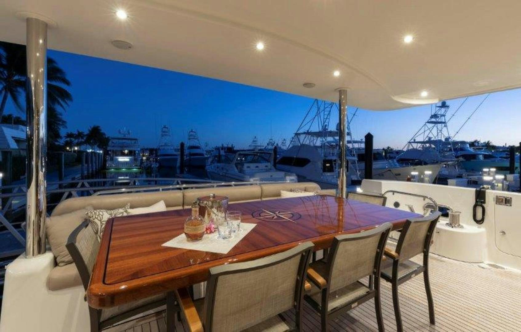 a table with glasses on it aboard CHERRY BOMB Yacht for Sale