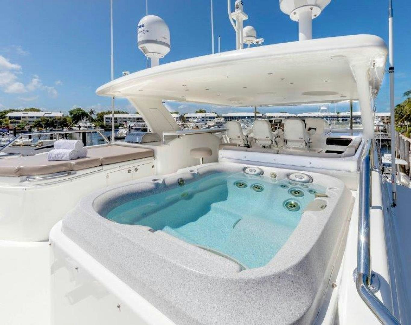 a large white boat with a blue water slide aboard CHERRY BOMB Yacht for Sale