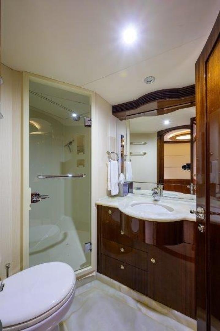 a bathroom with a glass shower aboard VIRGINIA SEA Yacht for Sale