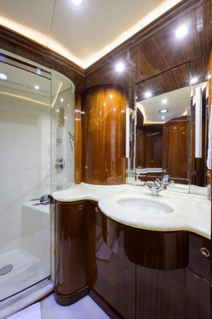 a bathroom with a sink and a mirror aboard VIRGINIA SEA Yacht for Sale