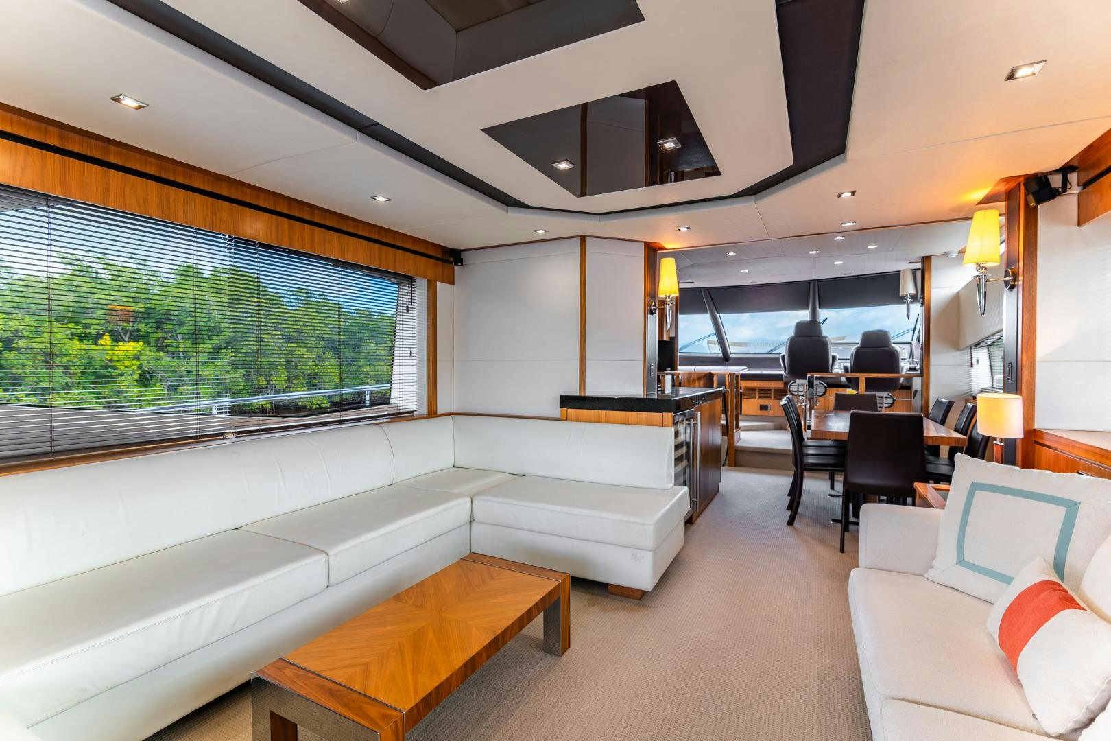 a room with a couch and a table and chairs aboard SOL Y LUNA Yacht for Sale