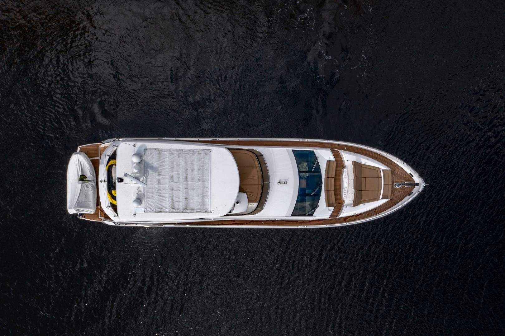 a pair of sunglasses on a black surface aboard SOL Y LUNA Yacht for Sale