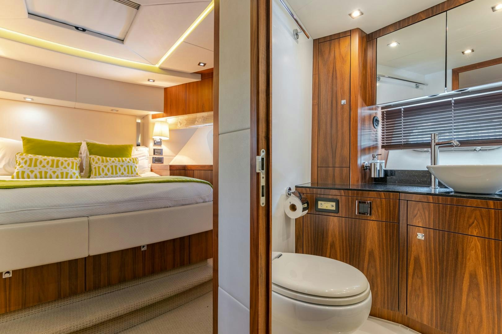 a bathroom with a sink and a bed aboard SOL Y LUNA Yacht for Sale