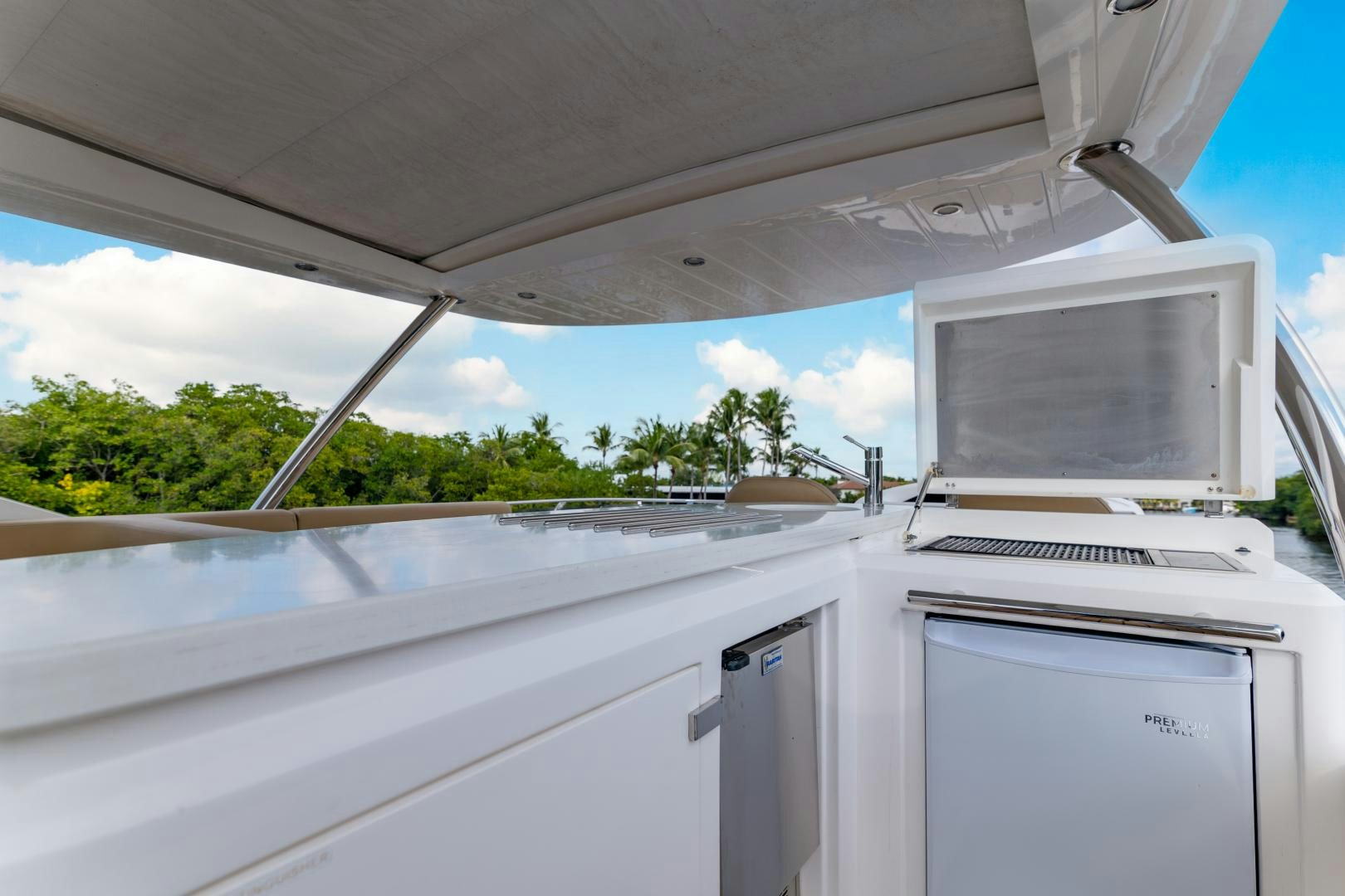 a white computer on a car aboard SOL Y LUNA Yacht for Sale