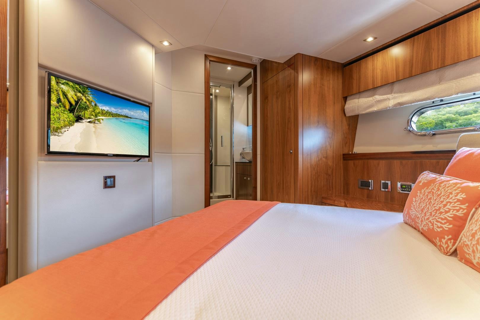 a hotel room with a bed and tv aboard SOL Y LUNA Yacht for Sale