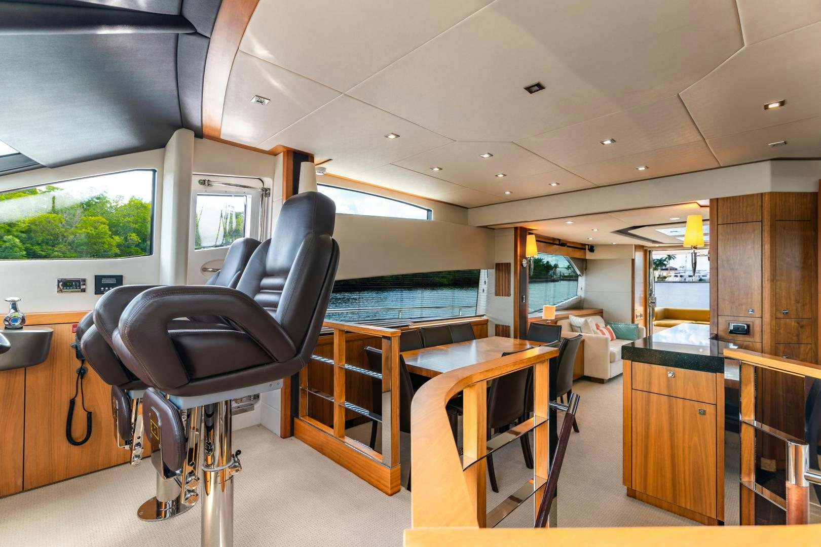 a room with a desk and chairs aboard SOL Y LUNA Yacht for Sale