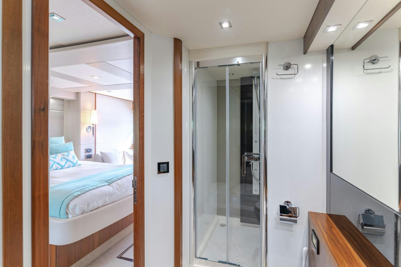 a bathroom with a glass shower aboard SOL Y LUNA Yacht for Sale