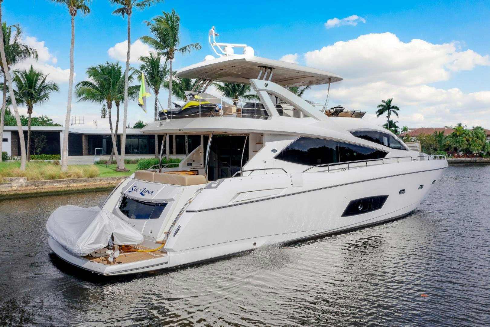 a white boat on a body of water aboard SOL Y LUNA Yacht for Sale