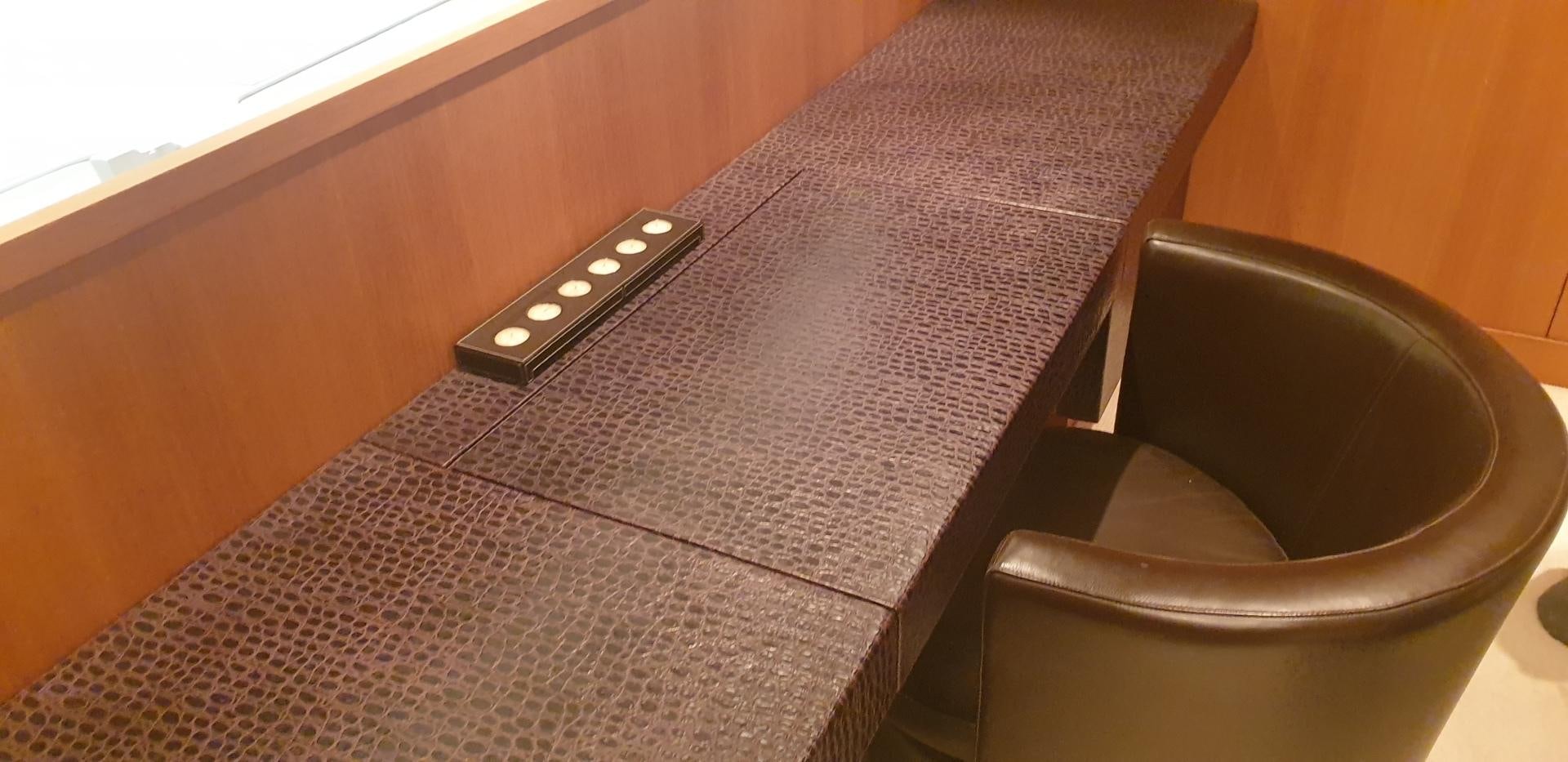 a leather chair on a bed aboard TIGRA Yacht for Sale