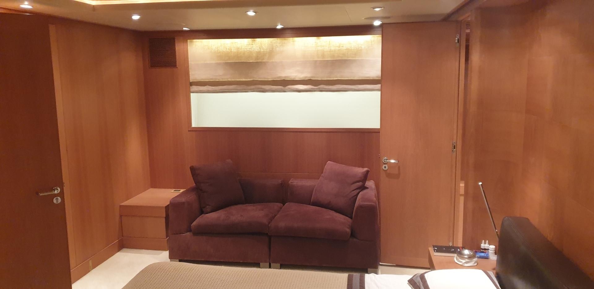 a room with a couch and a table aboard TIGRA Yacht for Sale