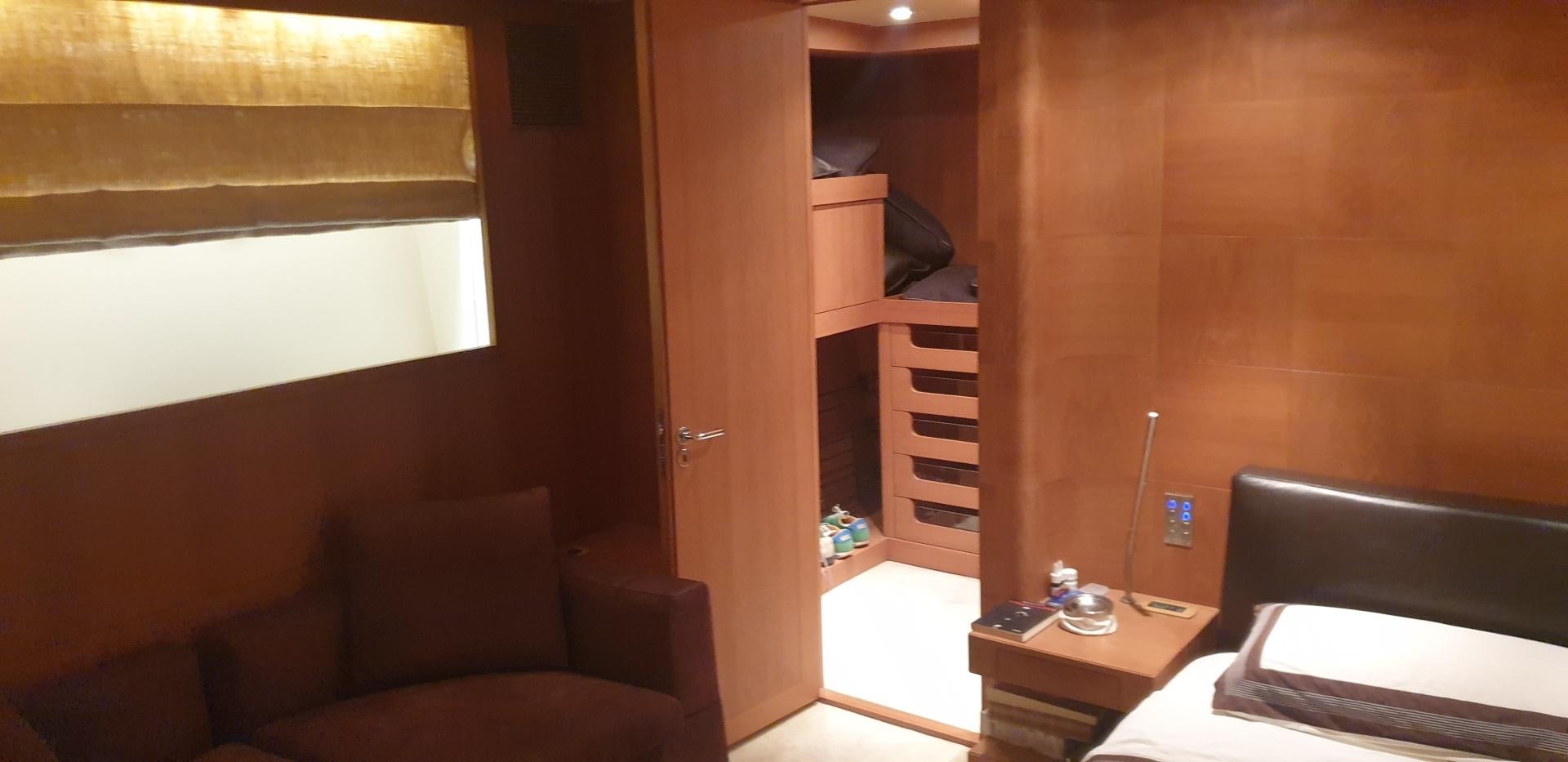 a room with a bed and a desk aboard TIGRA Yacht for Sale