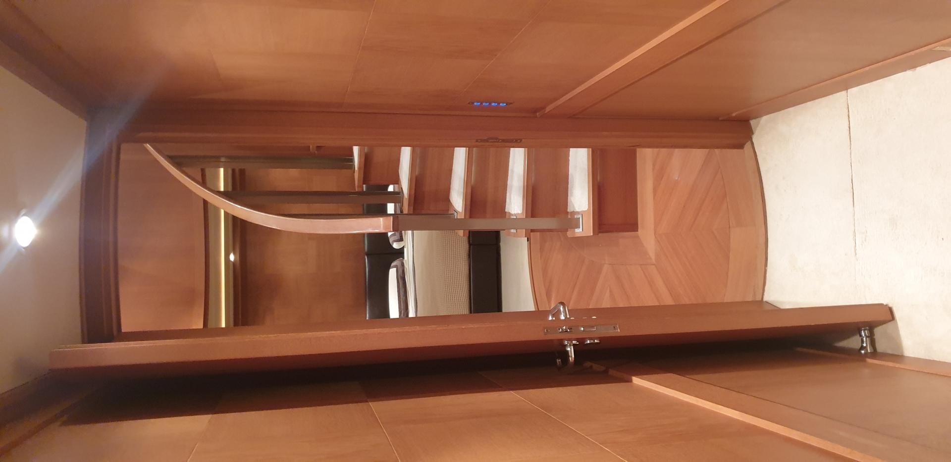 a room with a large mirror aboard TIGRA Yacht for Sale