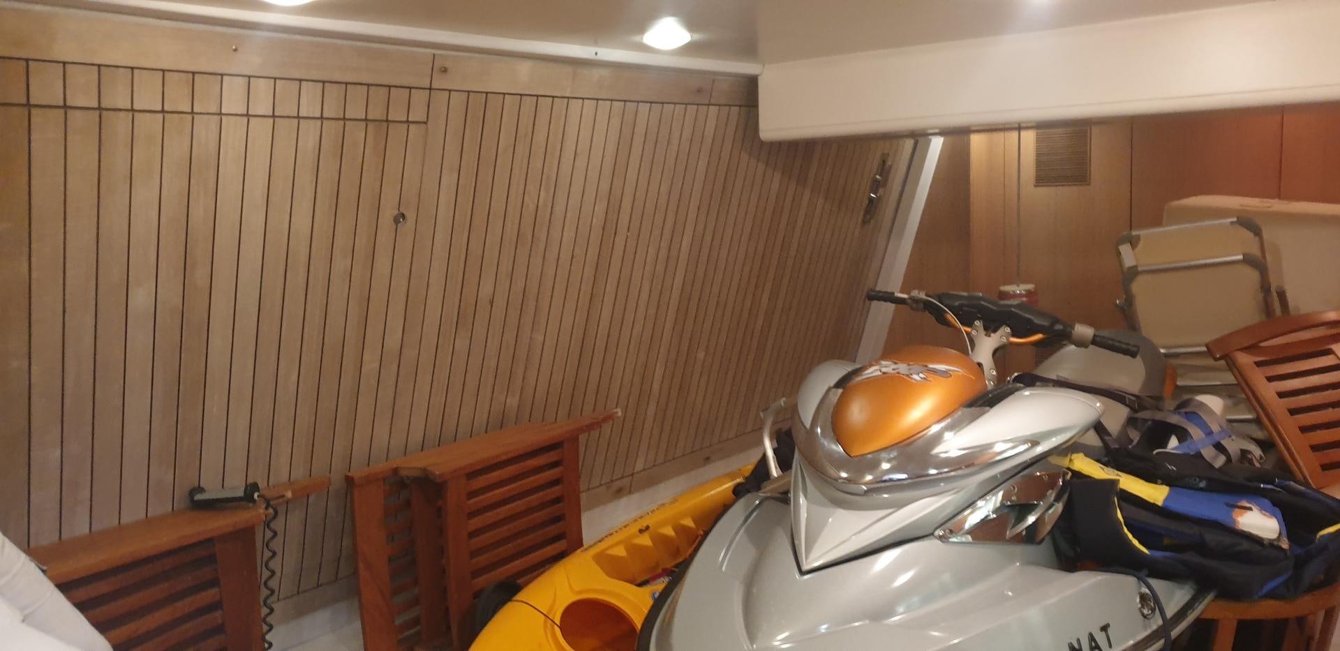 a room with a white wall and a metal bucket with a metal bucket on it aboard TIGRA Yacht for Sale